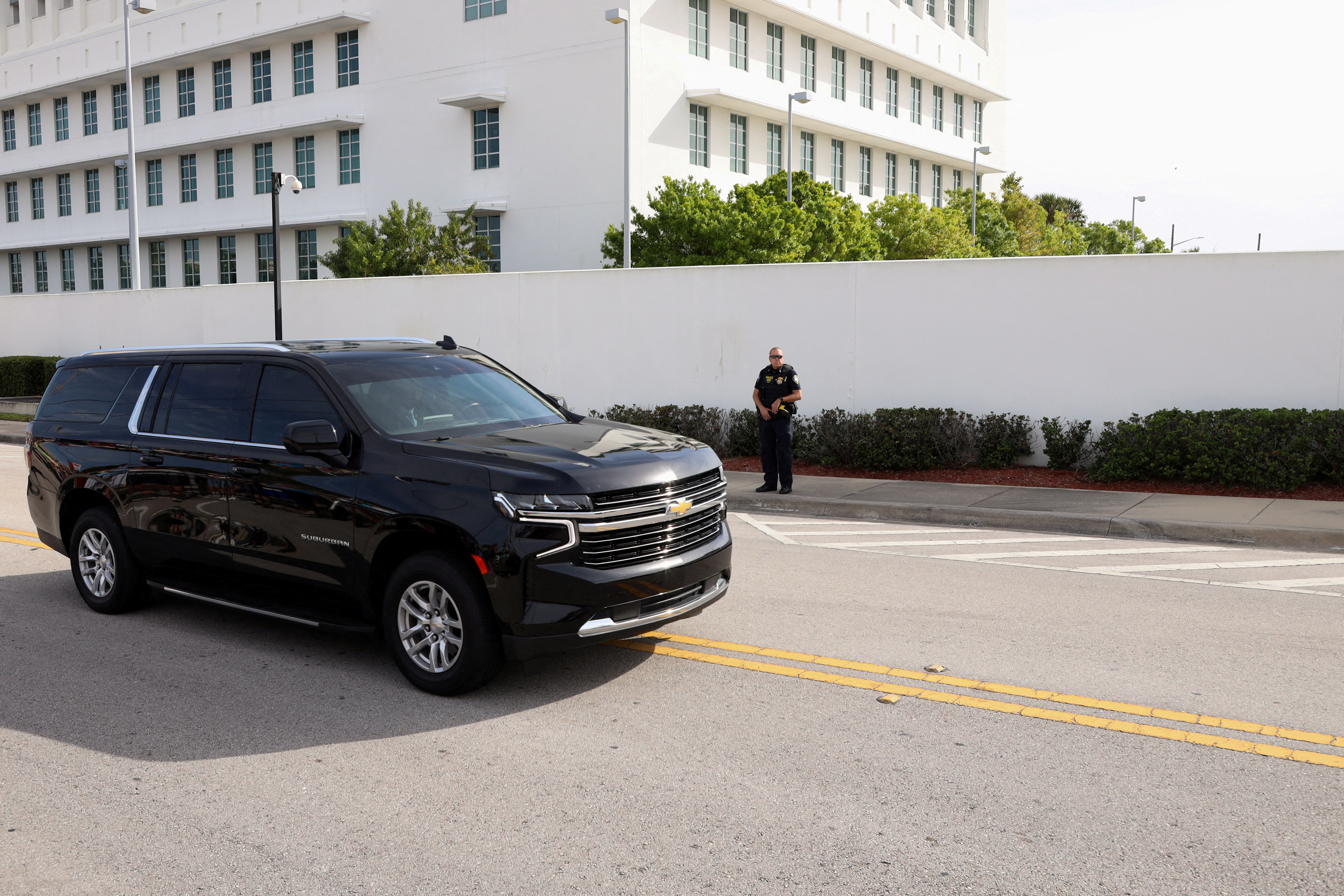 A vehicle, which is part of the motorcade of former U.S. President Donald Trump, arrives to the U.S. District Court Magistrate in Fort Pierce, Florida, U.S., March 1, 2024. REUTERS/Maria Alejandra Cardona
