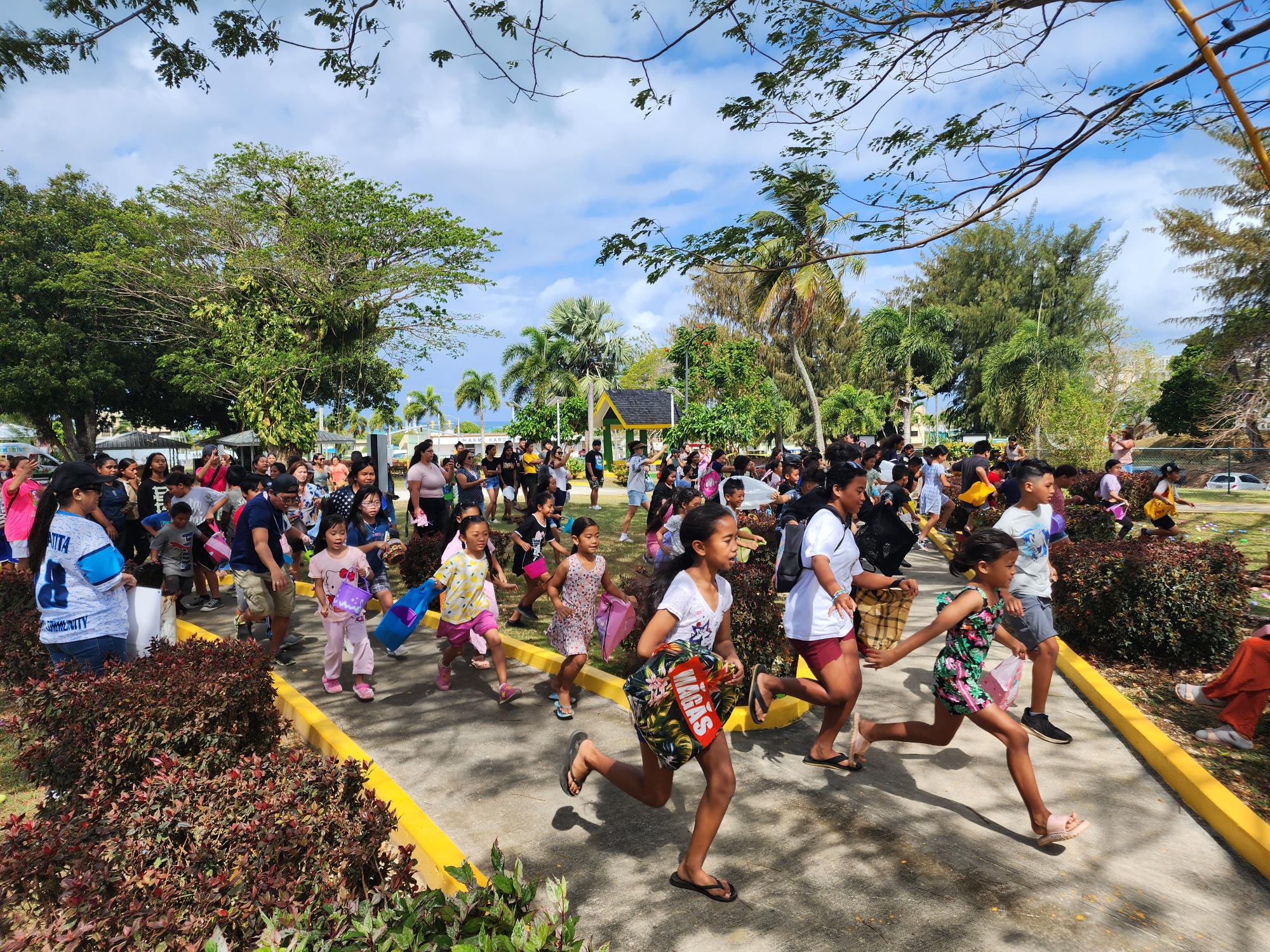 Enthusiastic children go on a hunt for Easter Eggs at Sugar King Park on Saturday morning. 
