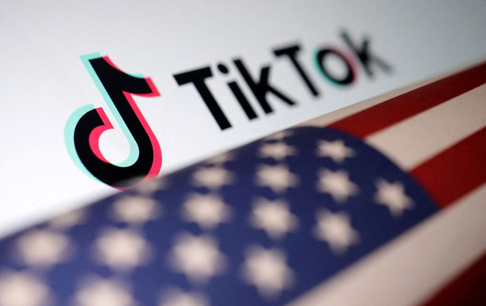 U.S. flag is placed on a TikTok logo in this illustration taken March 20, 2024. REUTERS/Dado Ruvic/Illustration/File Photo