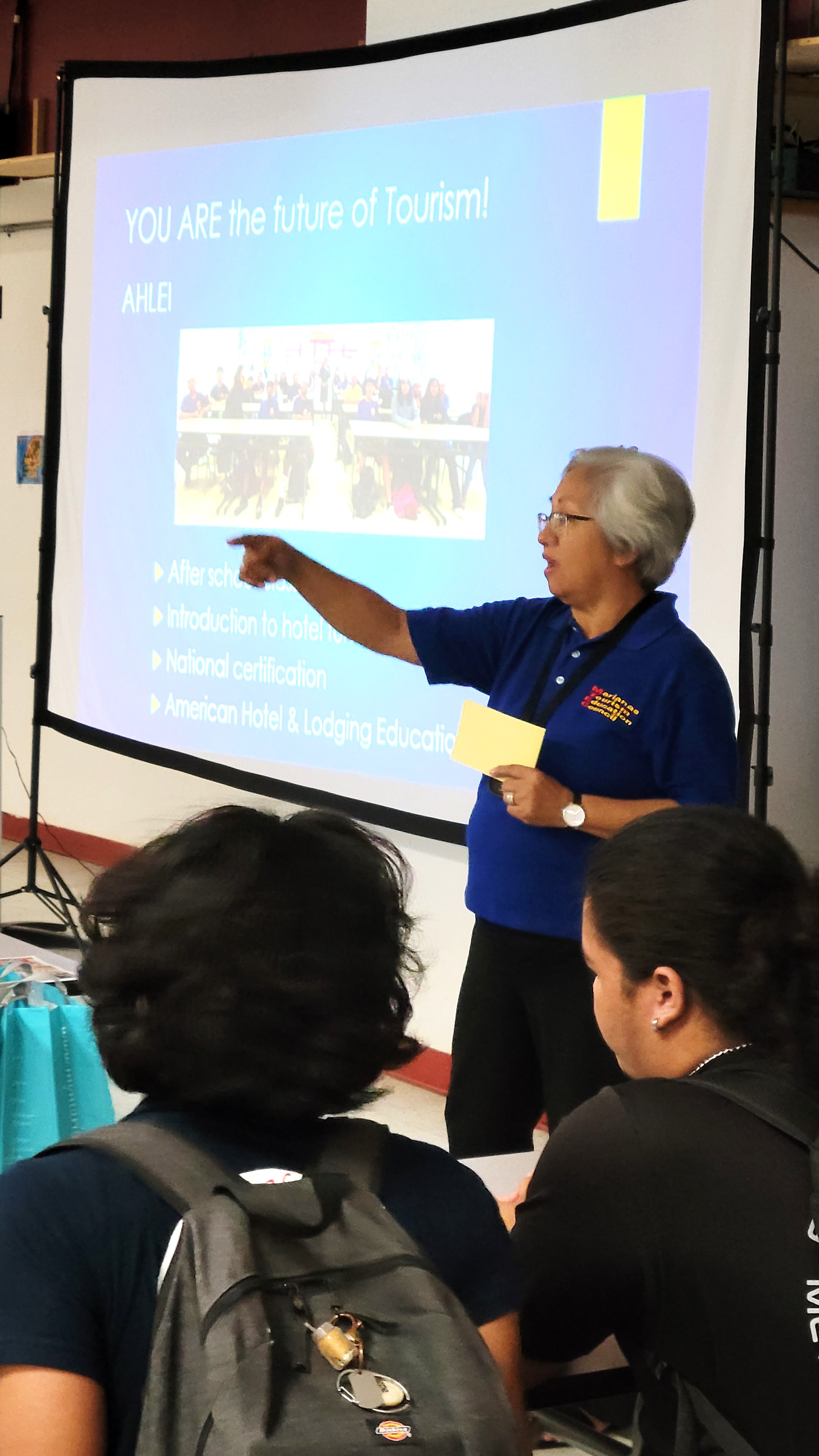 Marianas Tourism Education Council Chair Vicky Benavente shares pathways to career in tourism at Kagman High School during the educational outreach presentation of MTEC and the Marianas Visitors Authority on Feb. 28, 2024, at the school.