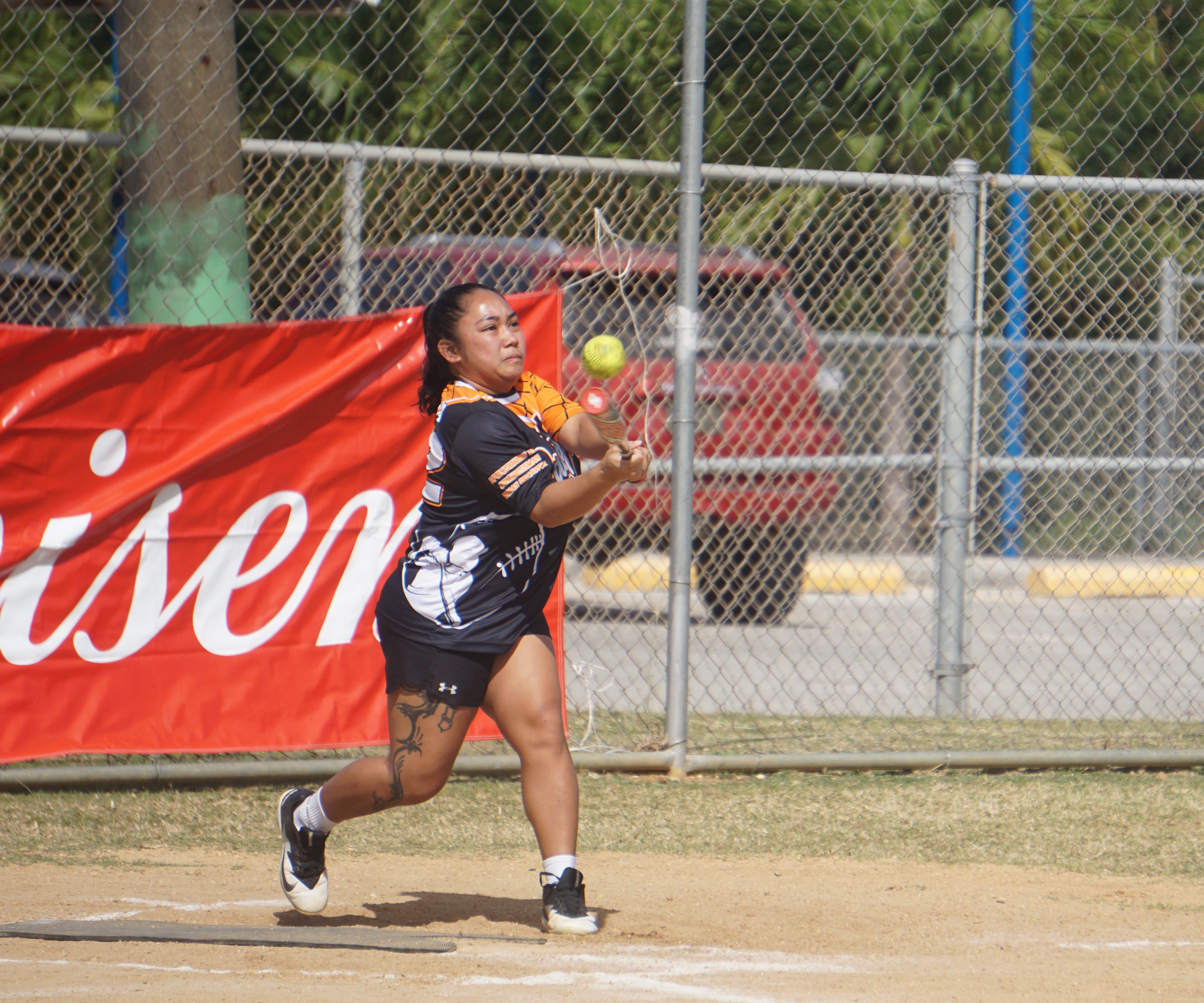 Lady SUFA's Ashley Muna connects a single during a women's division game of the 2024 Budweiser Belau Amateur Softball Association League at the Dandan baseball field.