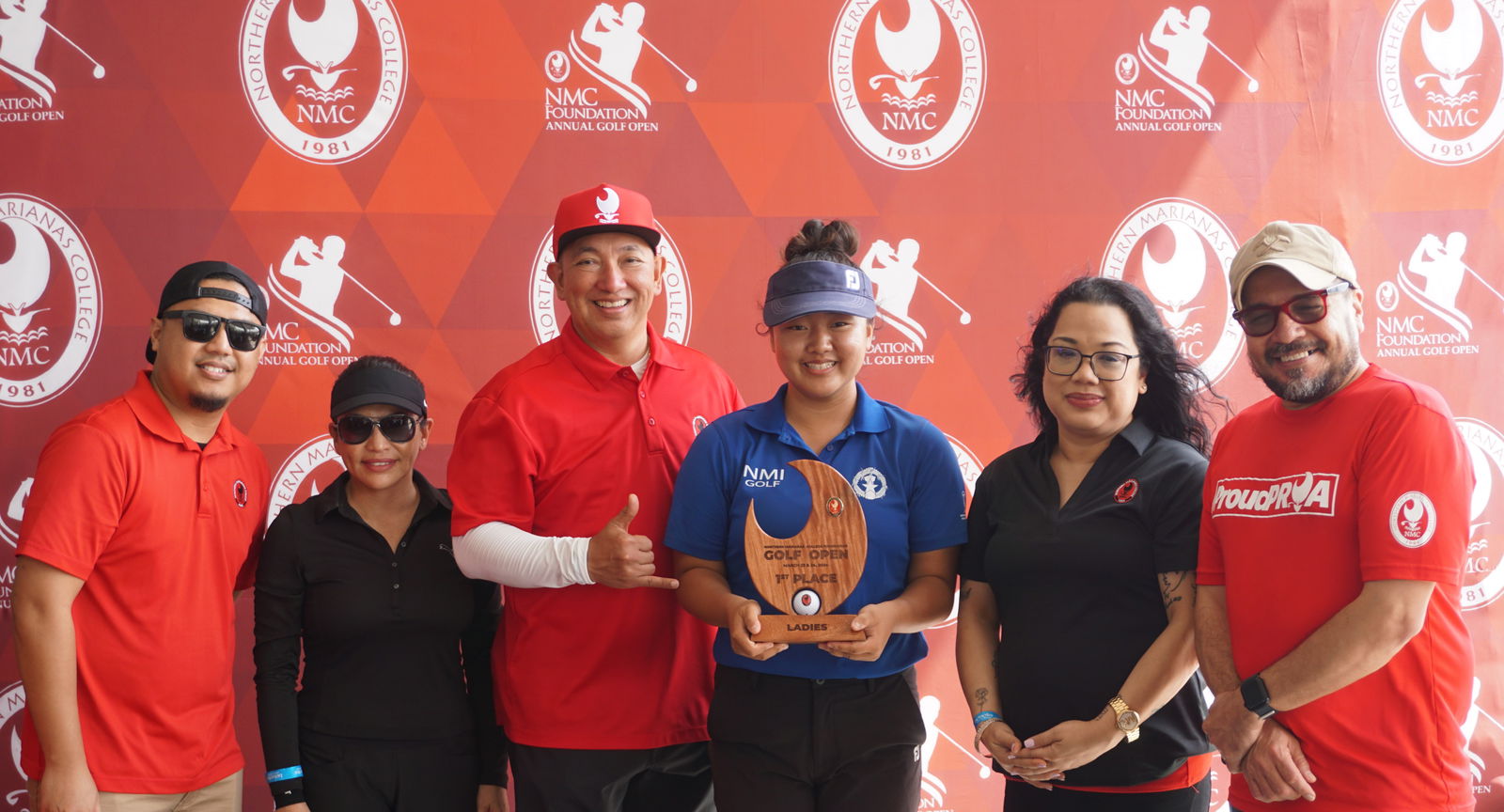 Zhimin Jin holds the Ladies Flight trophy as she poses for a photo with Northern Marianas College Foundation member Roman Tudela, Guam Hotel and Restaurant Association President Mary Rhodes, NMC Regent Dr. Jesse Tudela, NMC Regent Zenie Mafnas, and NMC President Galvin Deleon Guerrero, EdD, during the awards banquet of the NMC Foundation’s 19th Annual Golf Open at LaoLao Bay Golf & Resort on Sunday.