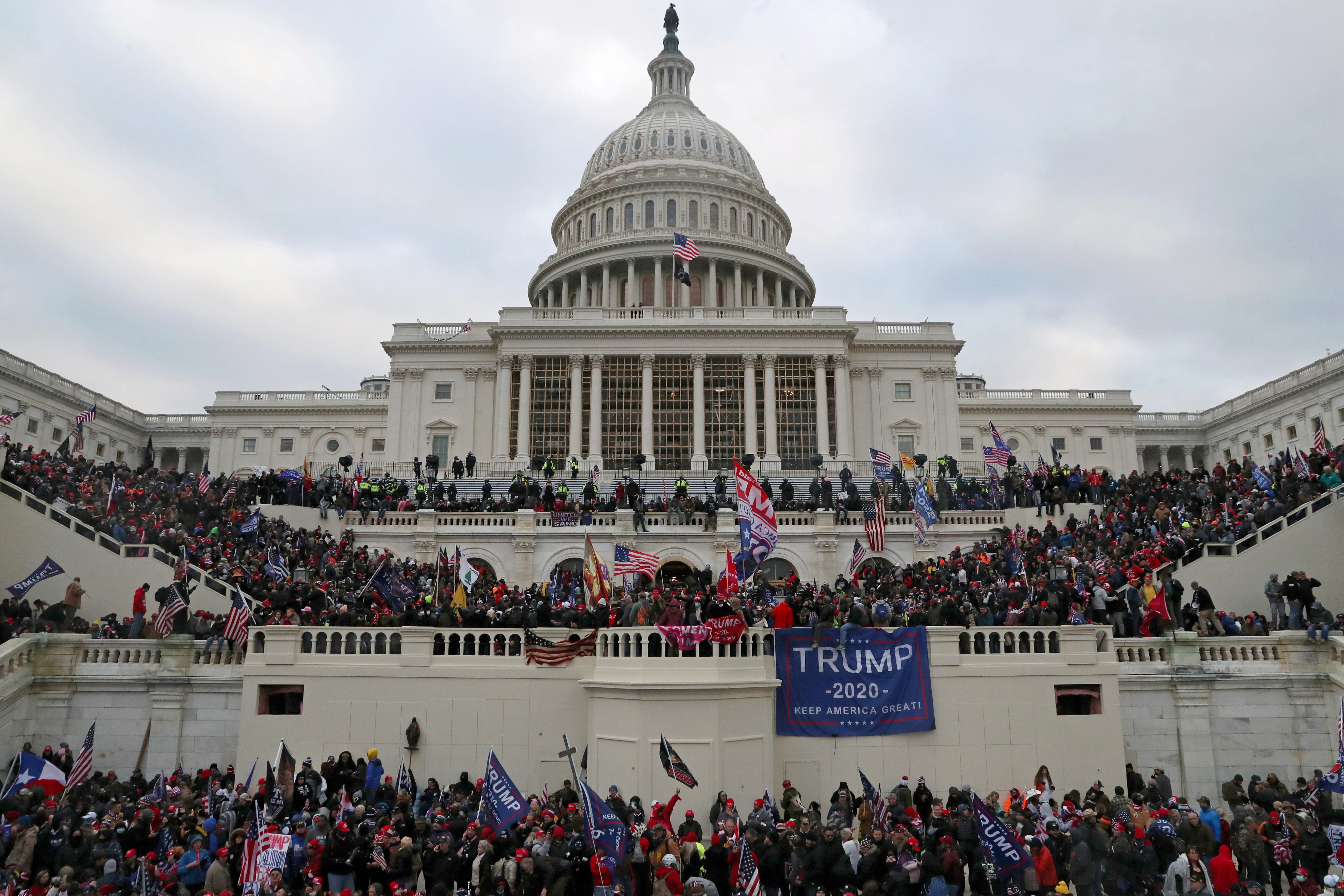 FILE PHOTO: A mob of supporters of U.S. President Donald Trump storm the U.S. Capitol Building in Washington, U.S., January 6, 2021. 