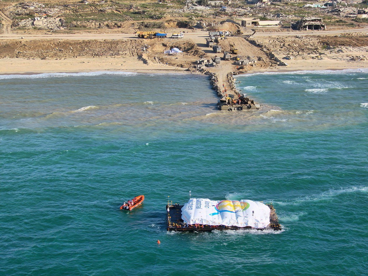 Aerial view shows a World Central Kitchen (WCK) barge loaded with food arriving off Gaza, where there is risk of famine after five months of Israel's military campaign, in this handout image released March 15, 2024. 