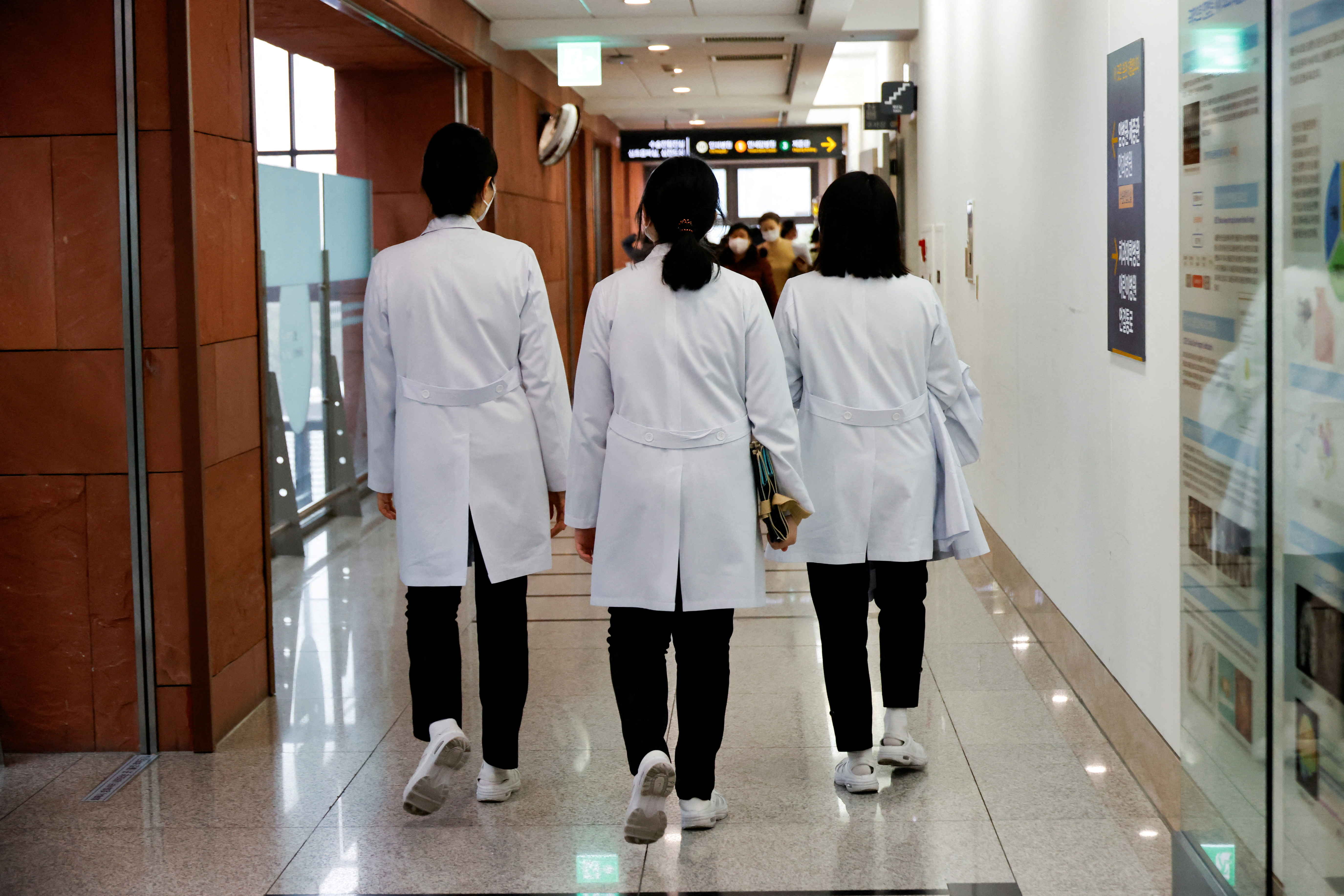 Medical workers walk at Severance Hospital in Seoul, South Korea, February 21, 2024. 