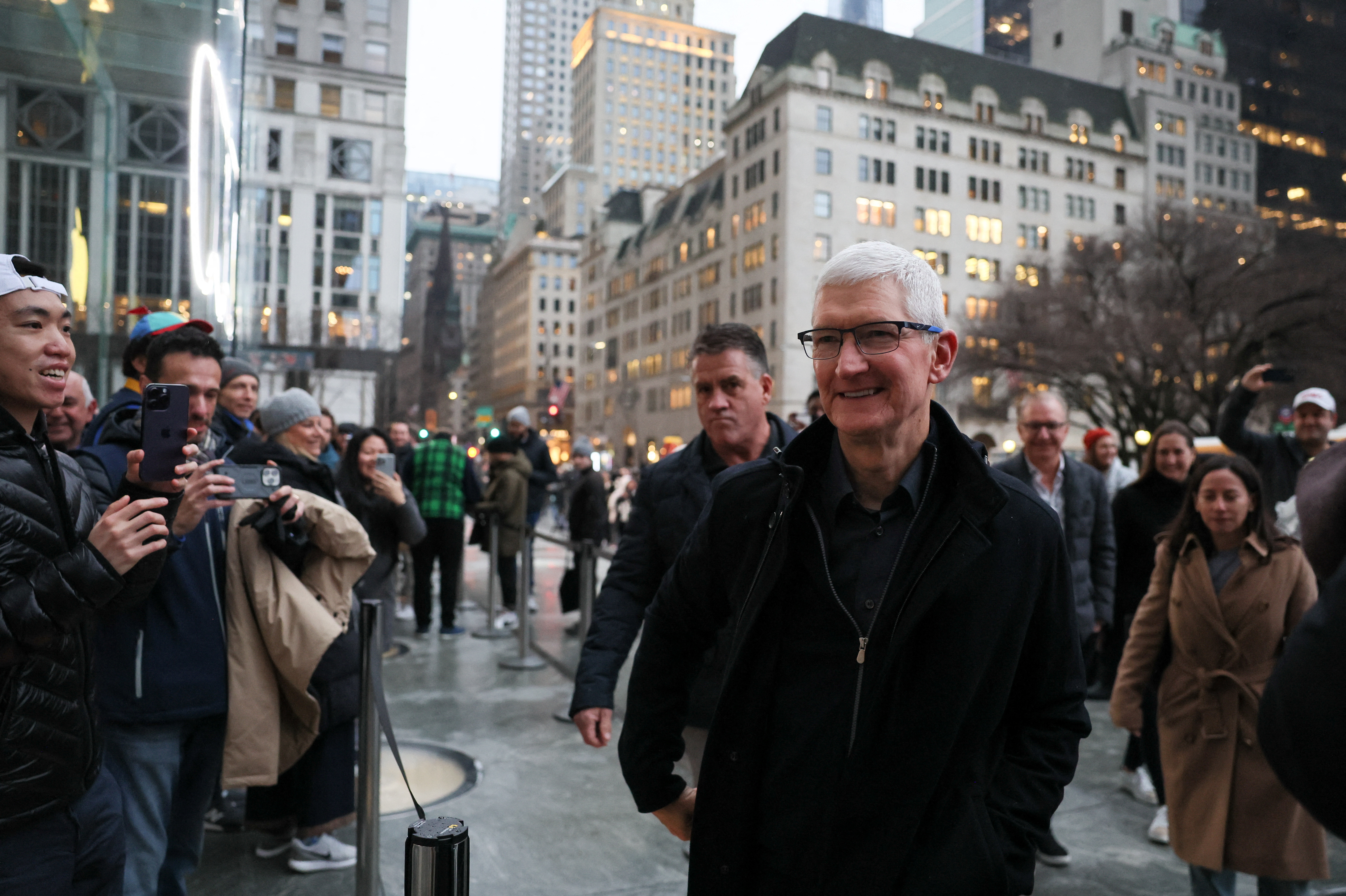 Apple CEO Tim Cook walks outside the Apple Fifth Avenue store as customers queue to buy Apple's Vision Pro headset, in Manhattan in New York City, U.S., February 2, 2024. 
