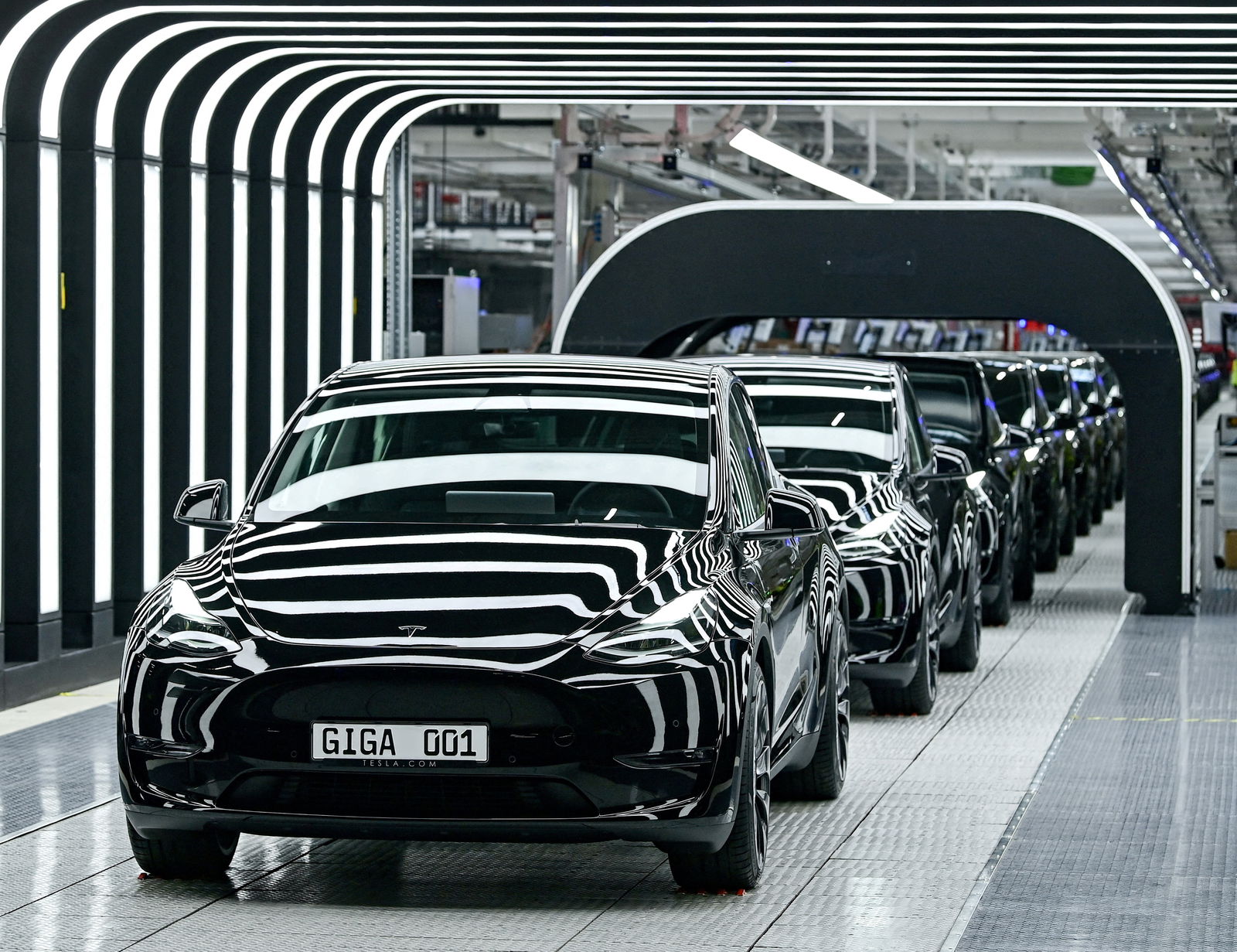 FILE PHOTO: Model Y cars are pictured during the opening ceremony of the new Tesla Gigafactory for electric cars in Gruenheide, Germany, March 22, 2022. 