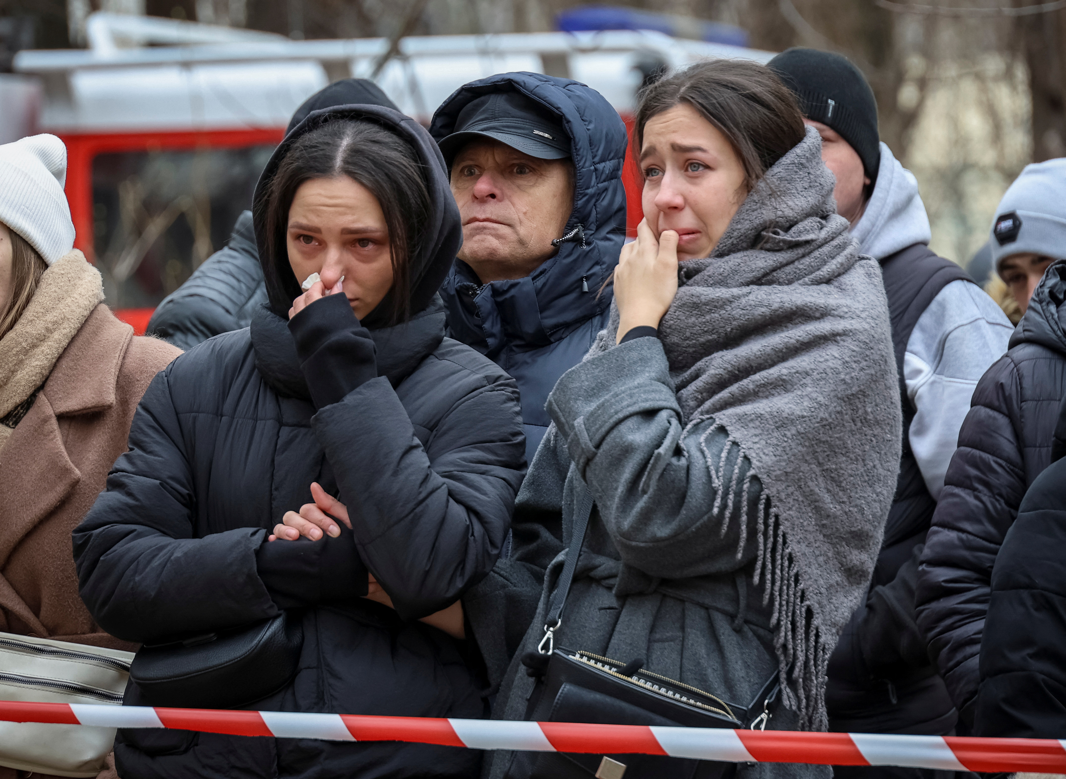 Local residents react at the site of an apartment building heavily damaged by a Russian drone strike, amid Russia's attack on Ukraine, in Odesa, Ukraine March 2, 2024. 