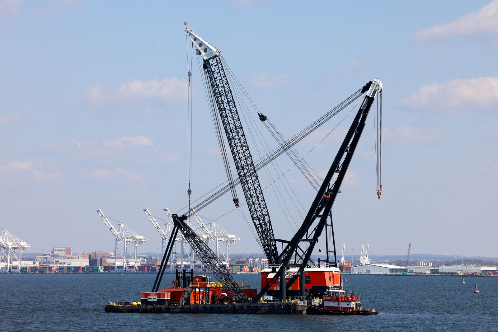 Large cranes in the Patapsco River near the collapsed Francis Scott Key Bridge in Baltimore, Maryland, U.S., March 29, 2024. 