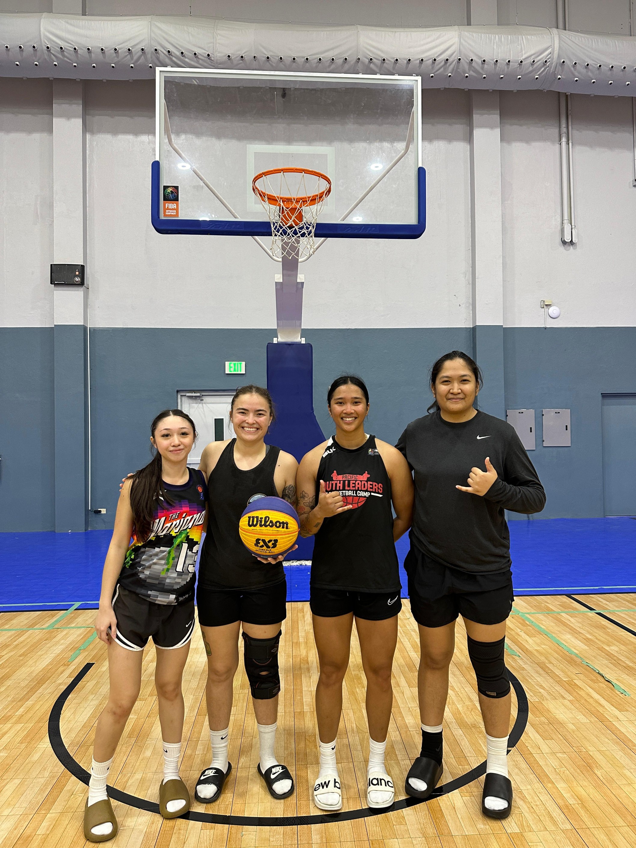 Kaia Travilla, Mikki Kautz, Jan Travilla, and Madi Alegre pose for a photo after winning the NMIBF Marianas Arsenal 3x3 Basketball Series last month at the Ada gym.