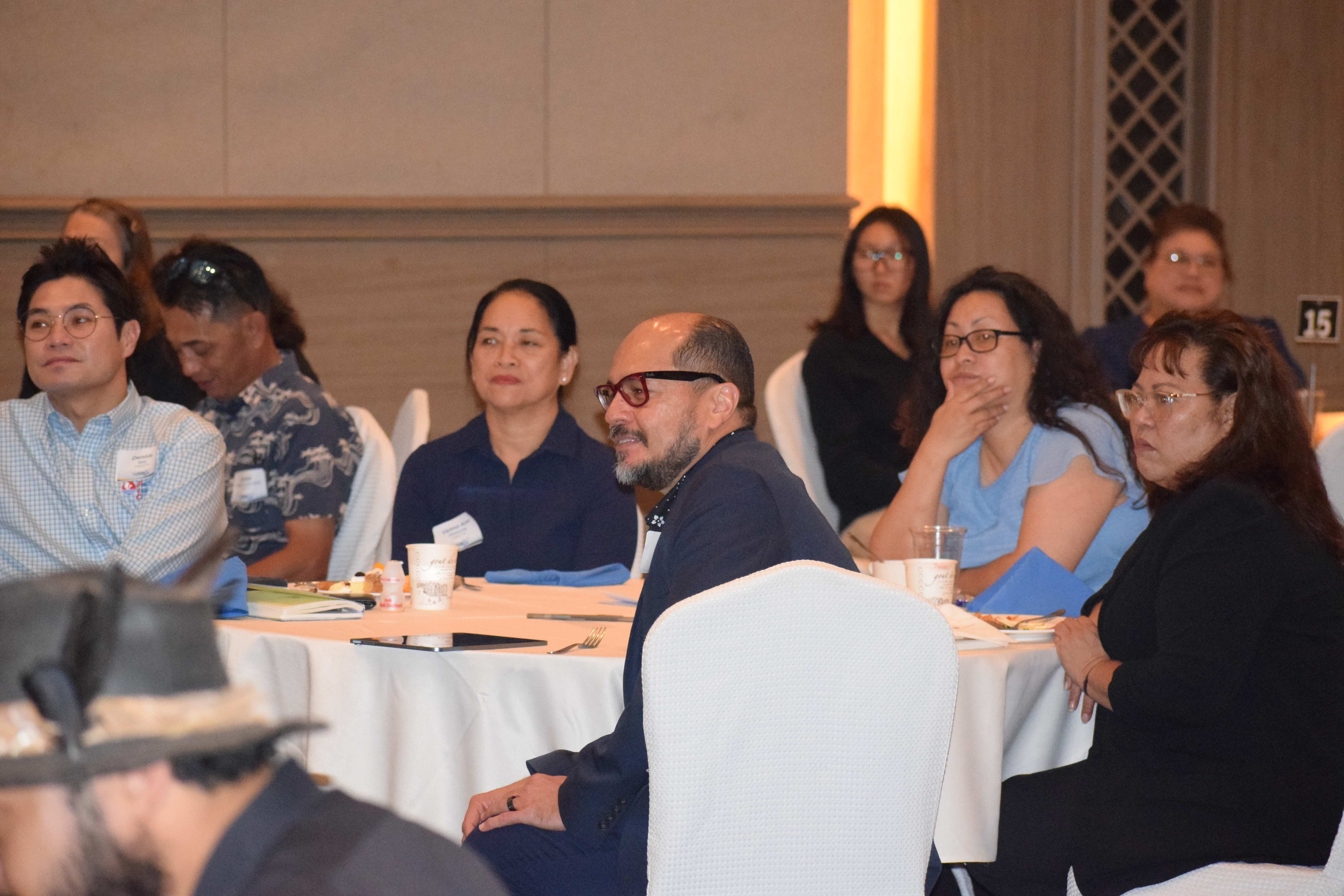 Sen. Celina R. Babauta, right, NMC President Dr. Galvin Deleon Guerrero, center, and Hotel Association of NMI Chairman Dennis Seo, left, listen to the governor's remarks.