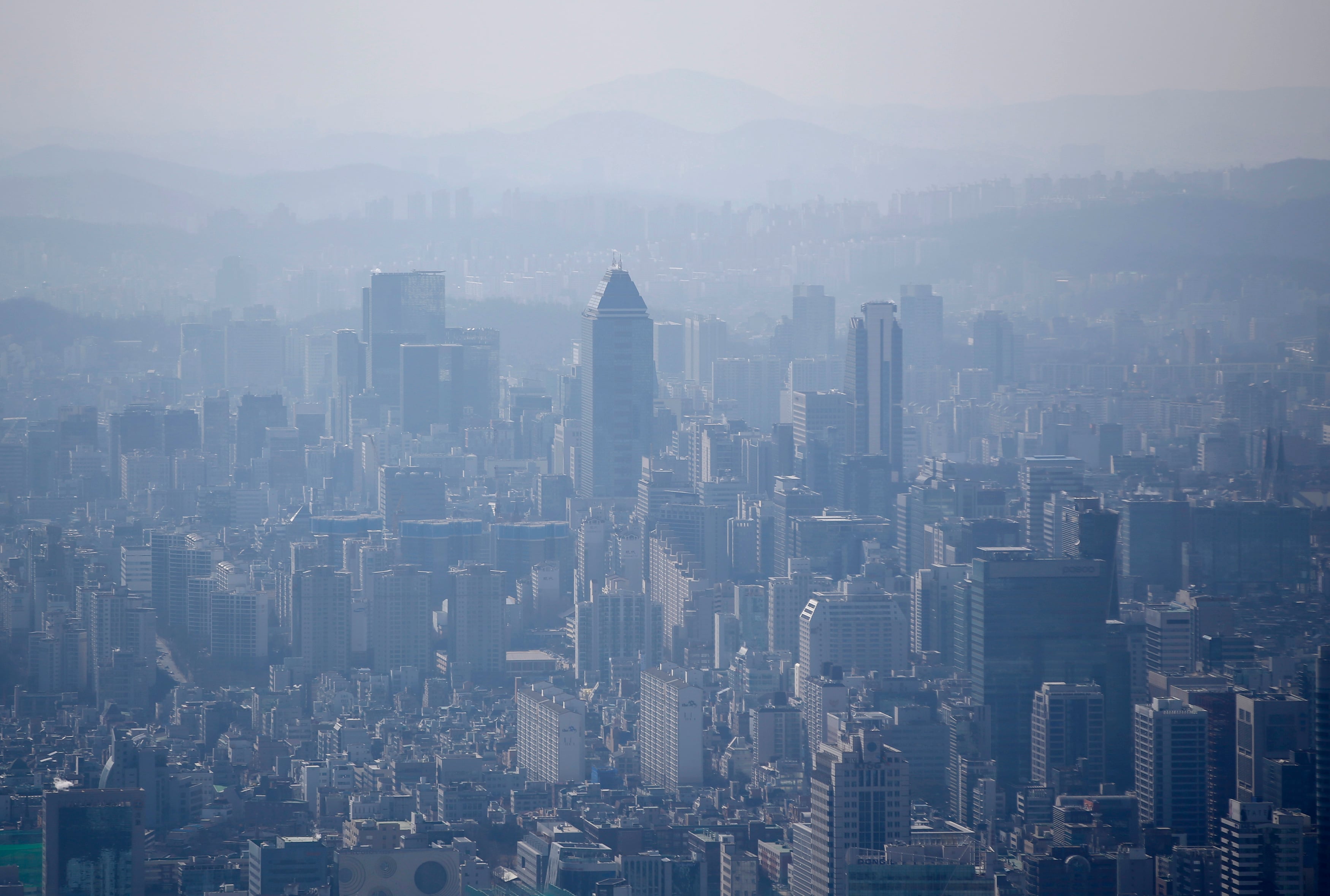 The skyline of central Seoul is seen during a foggy day in Seoul March 4, 2015. 