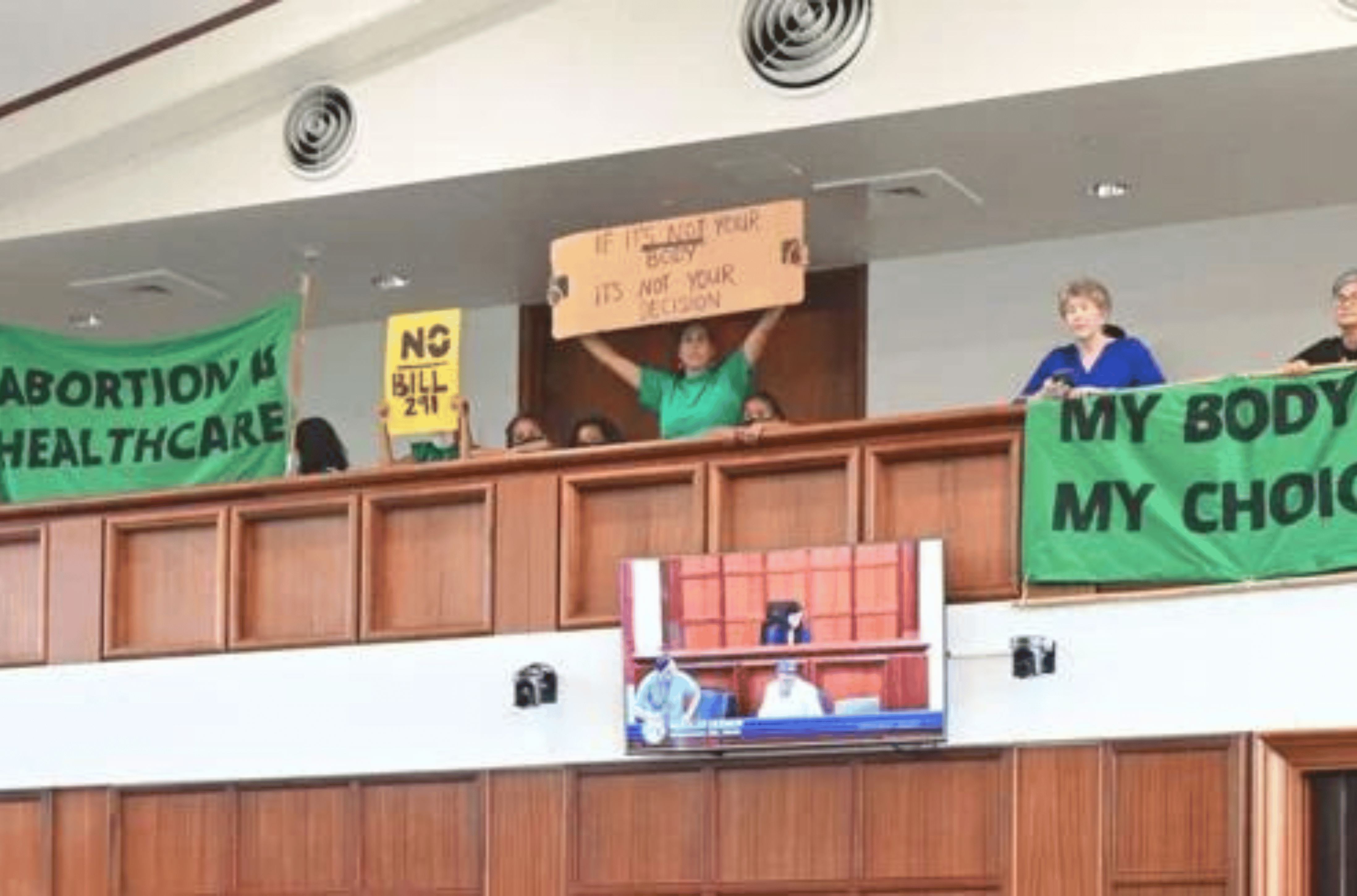 Abortion rights protesters demonstrate in the gallery of the legislative session hall Dec. 29, 2022, at the Guam Congress Building in Hagåtña. 