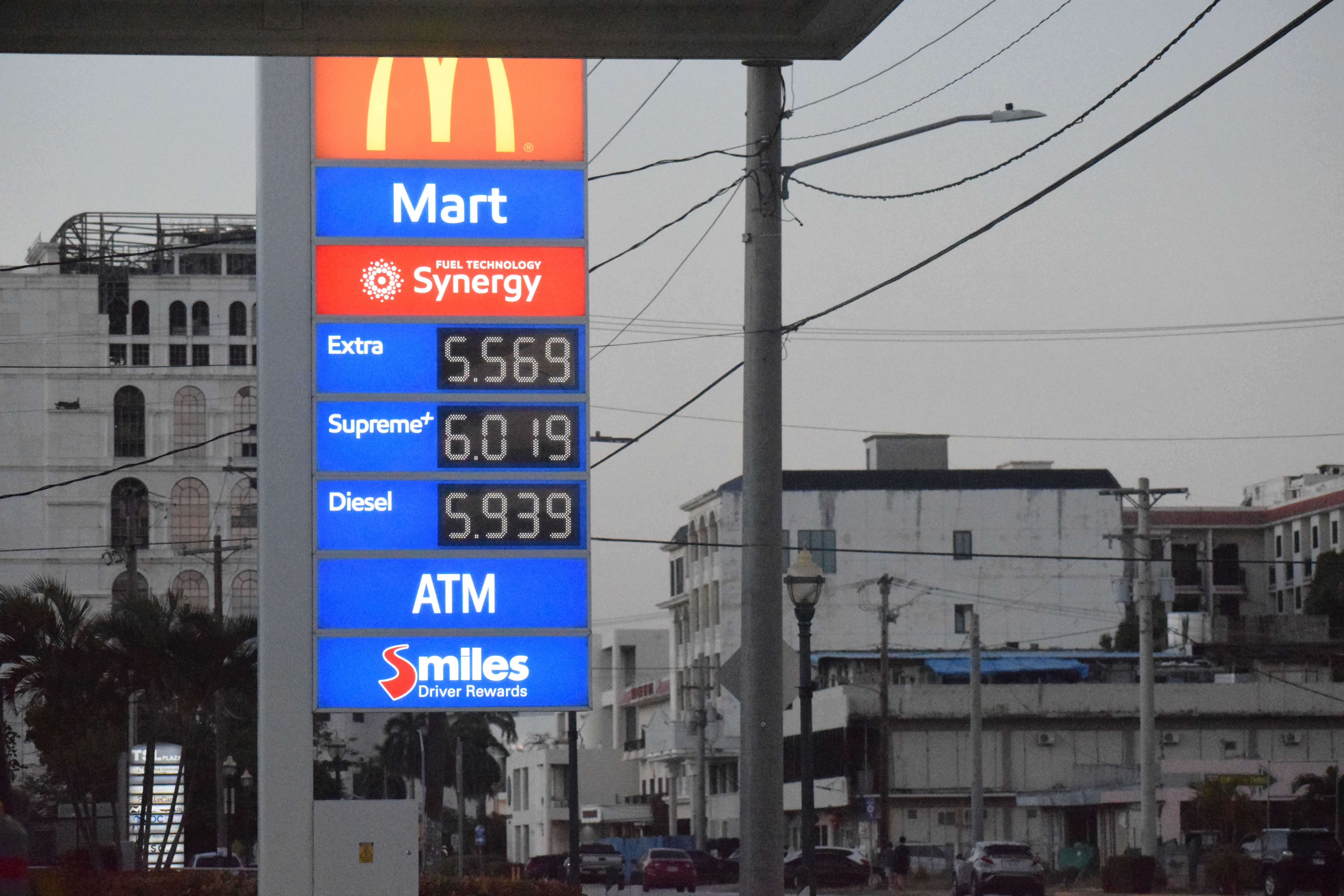 Mobil Oil Marianas on Beach Road in Garapan displays its new prices on Tuesday evening.