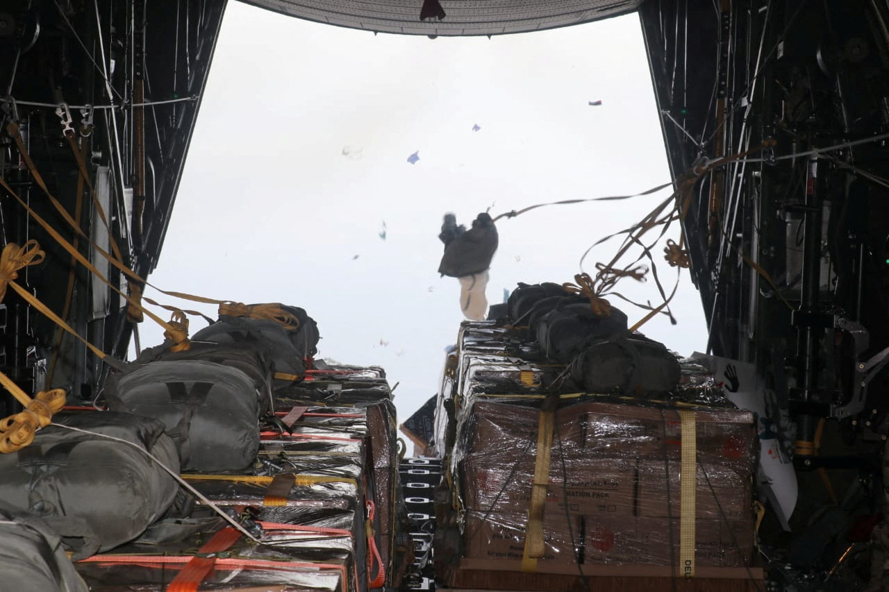 A picture released on March 2, 2024, by the Jordanian Armed Forces website shows what it said was food aid to be air-dropped to Gaza, in an operation it said was being carried out with the participation of the United States for the first time, in Amman, Jordan. 