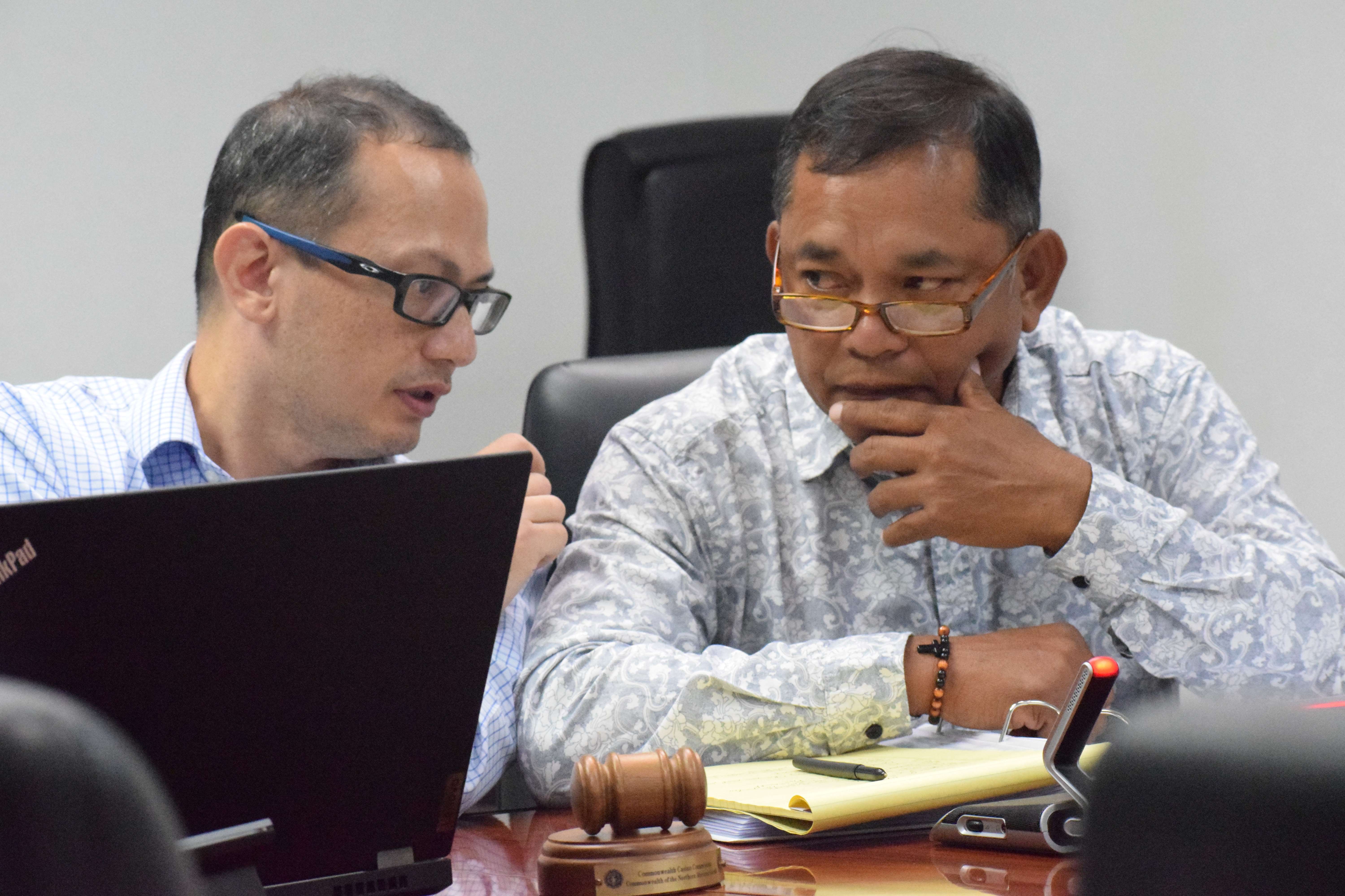 Acting Commonwealth Casino Commission Chai Ralph S. Demapan listens to Assistant Attorney General Carl Dela Cruz during a revocation hearing on Feb. 29, 2024 in the governor's conference room on Capital Hill.