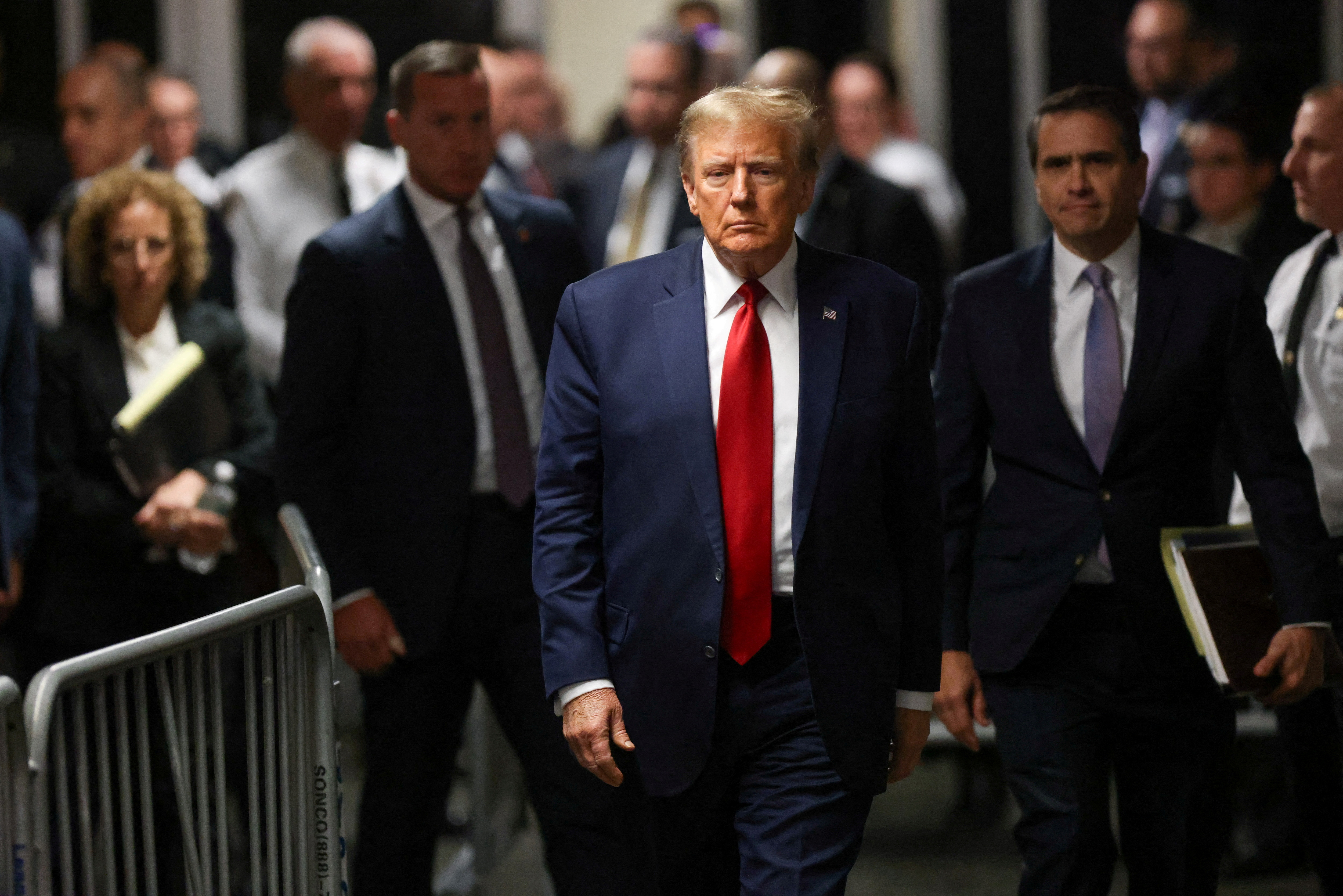 FILE PHOTO: Former U.S. President Donald Trump walks outside the courtroom on the day of a court hearing on charges of falsifying business records to cover up a hush money payment to a porn star before the 2016 election, in New York State Supreme Court in the Manhattan borough of New York City, U.S., February 15, 2024. 