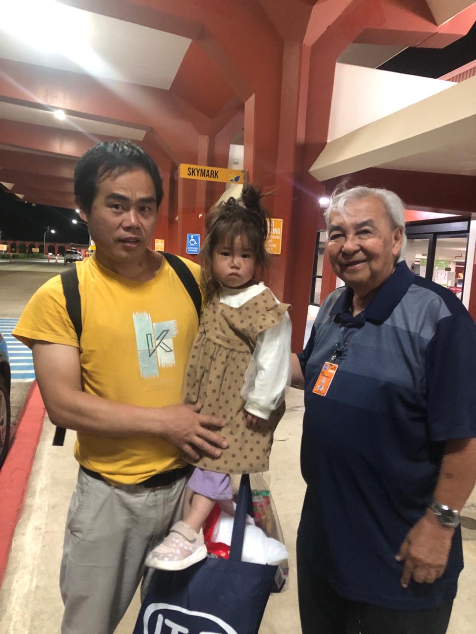 Commonwealth Ports Authority Executive Director Leo Tudela, right, poses for a photo with Xu Yuejun and daughter Ziyu before they boarded a plane  to China on Friday morning.