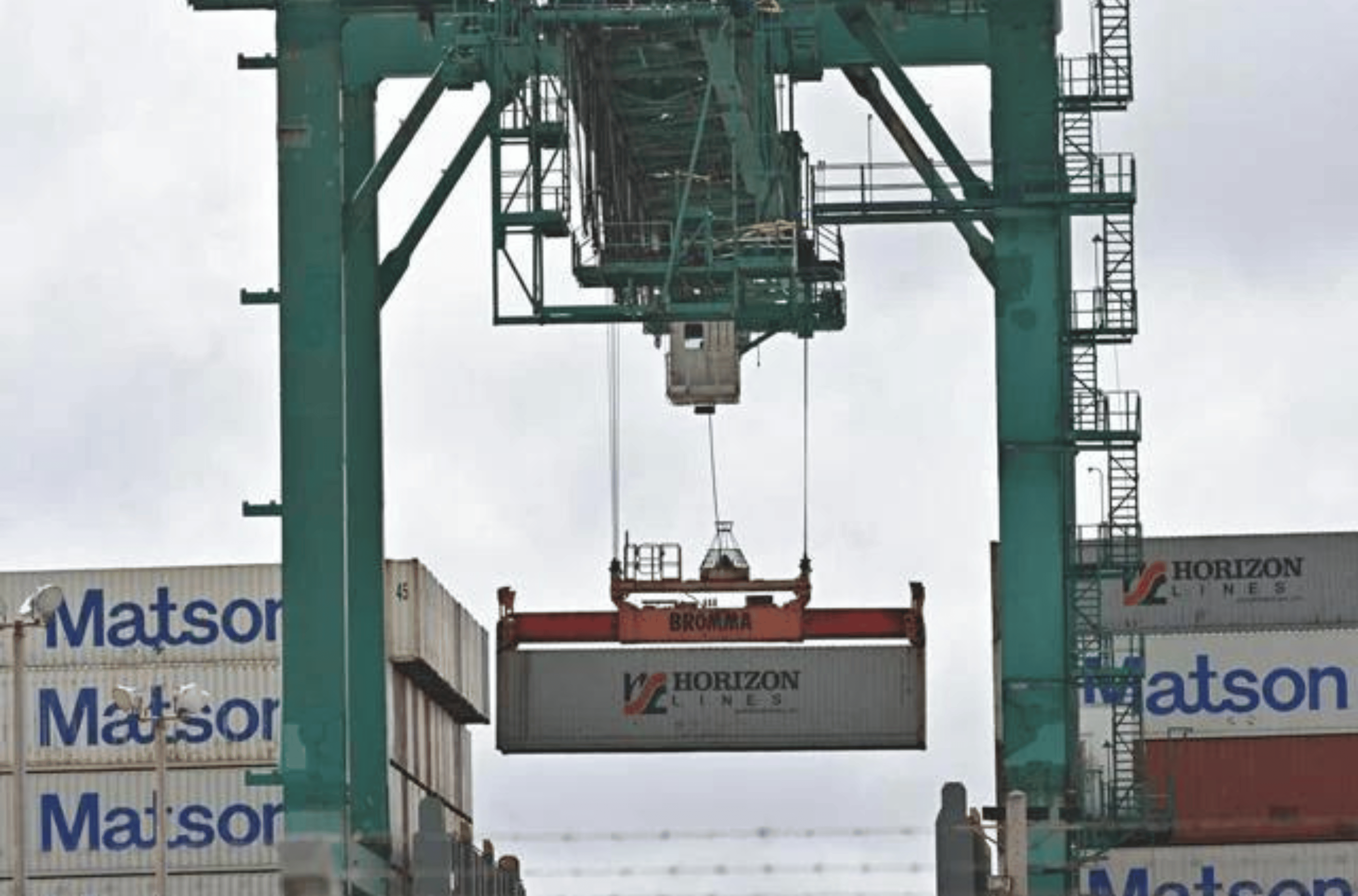 A Port Authority of Guam gantry crane unloads a container on Thursday, Jan. 4, 2024, in Piti. 