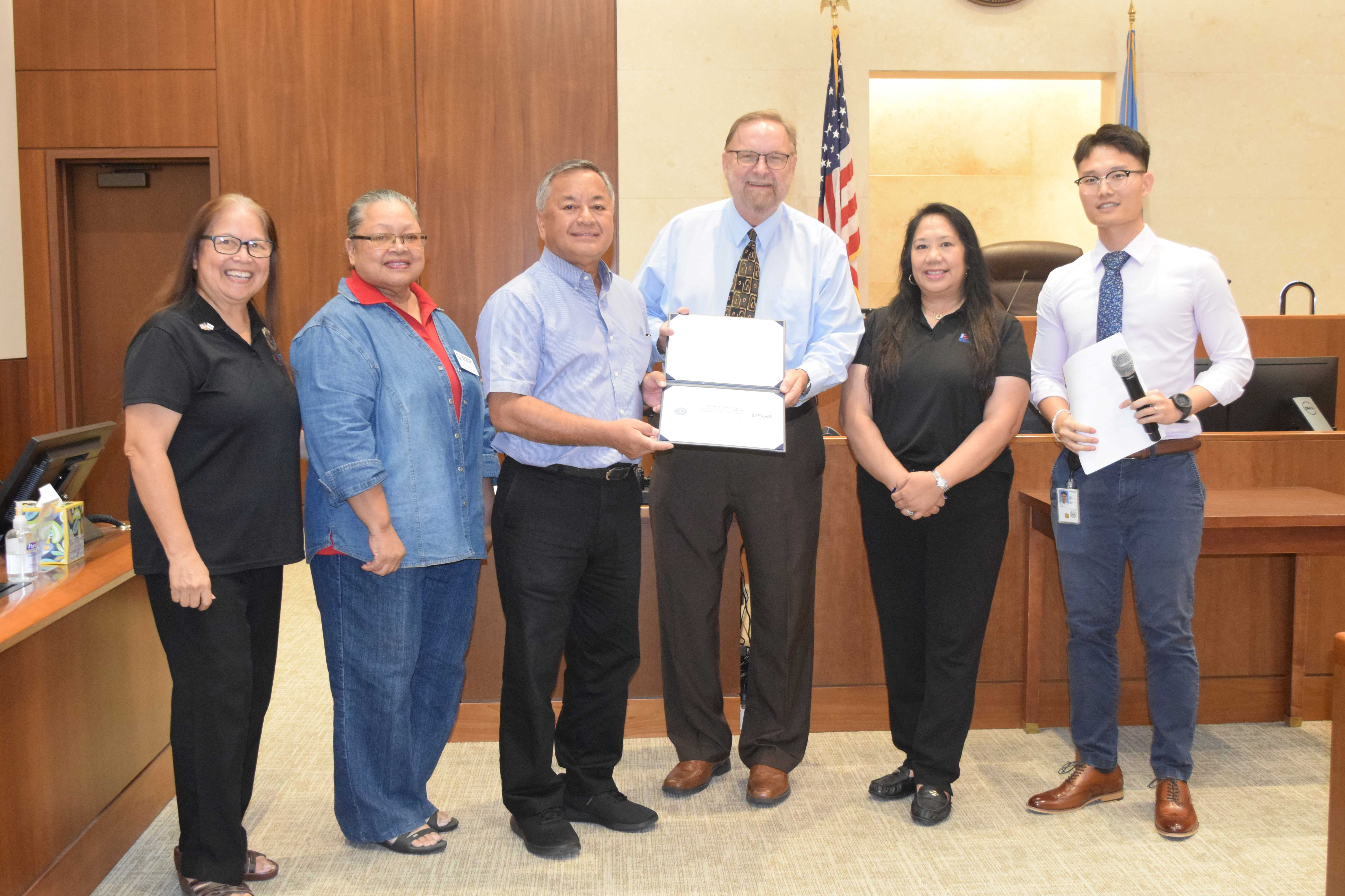 District Court for NMI Chief Deputy Clerk William J. Bezzant, third right, and U.S. Air Force Reserve Senior Airman Justin Xu Poon, right, with Employer Support for the Guard and Reserve Guam-CNMI Area Chair Rita A. Sablan, Ed.D., left, Civilian Aide to the U.S. Secretary of Army Mike Sablan, third left, ESGR Ombudsman Joann Aquino, second right, and Employer Outreach Coordinator Rose Igitol, second left.