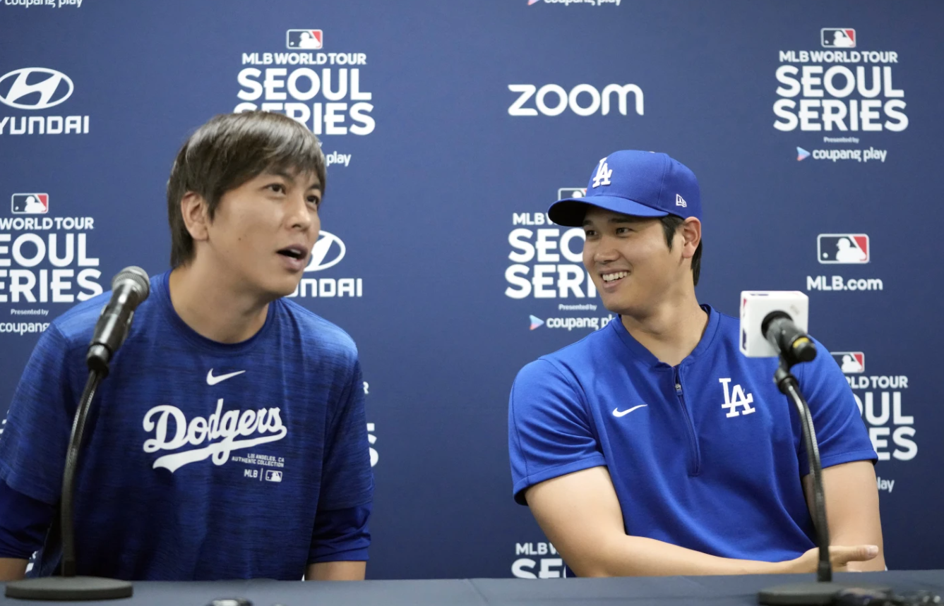 Los Angeles Dodgers’ Shohei Ohtani, right, and his interpreter, Ippei Mizuhara, attend a news conference ahead of a baseball workout at Gocheok Sky Dome in Seoul, South Korea, Saturday, March 16, 2024.