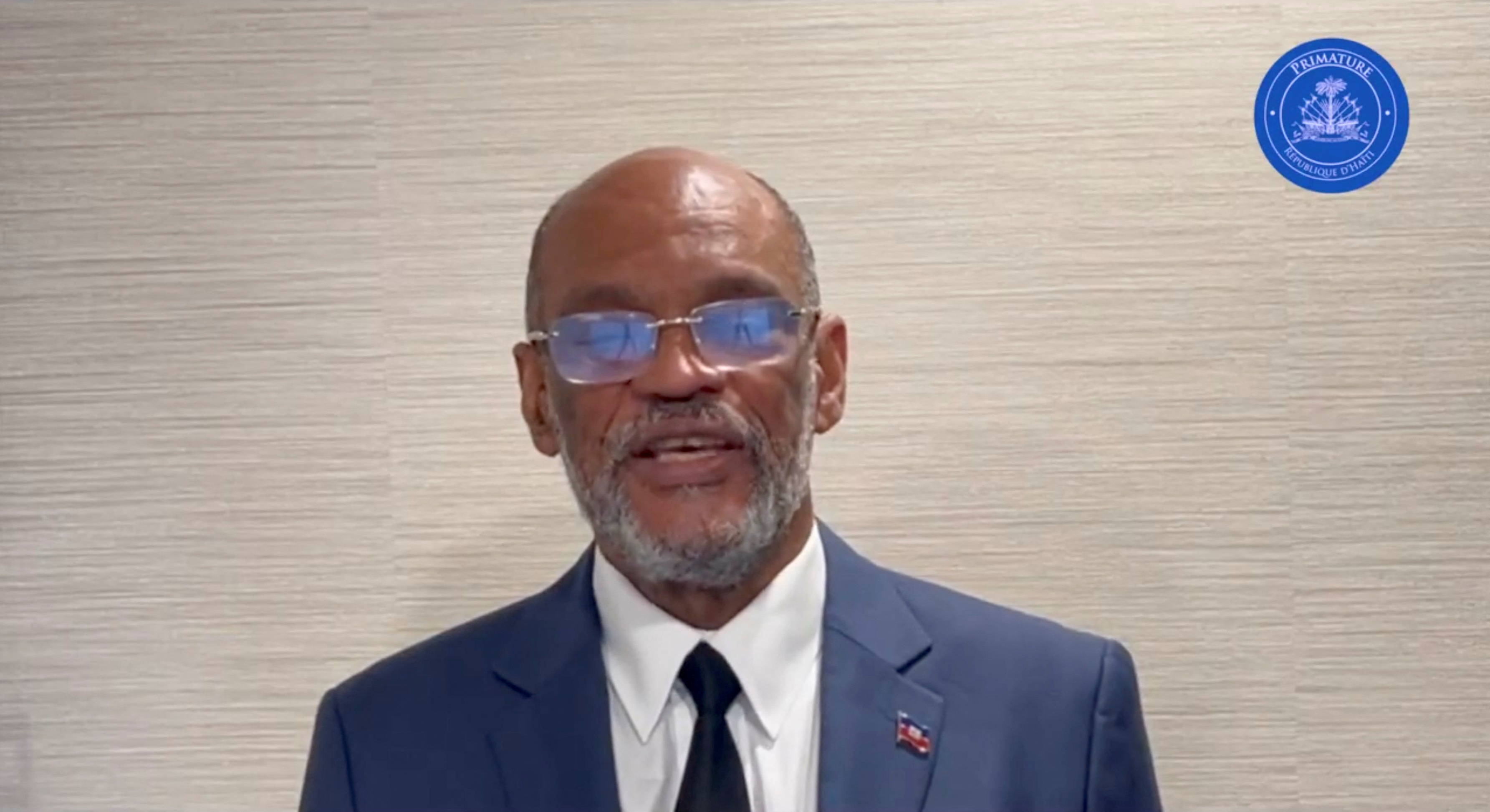 Haiti's Prime Minister Ariel Henry speaks while addressing the nation, at an unidentified location on a date given as March 11, 2024, in this screengrab obtained from a handout video. 