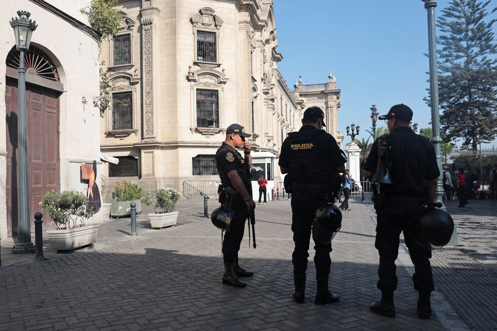 Police officers stand outside the Government Palace after prosecutors raided home of President Dina Boluarte as part of inquiries into possible illicit enrichment and failure to declare ownership of luxury watches, in Lima, Peru March 30, 2024. 