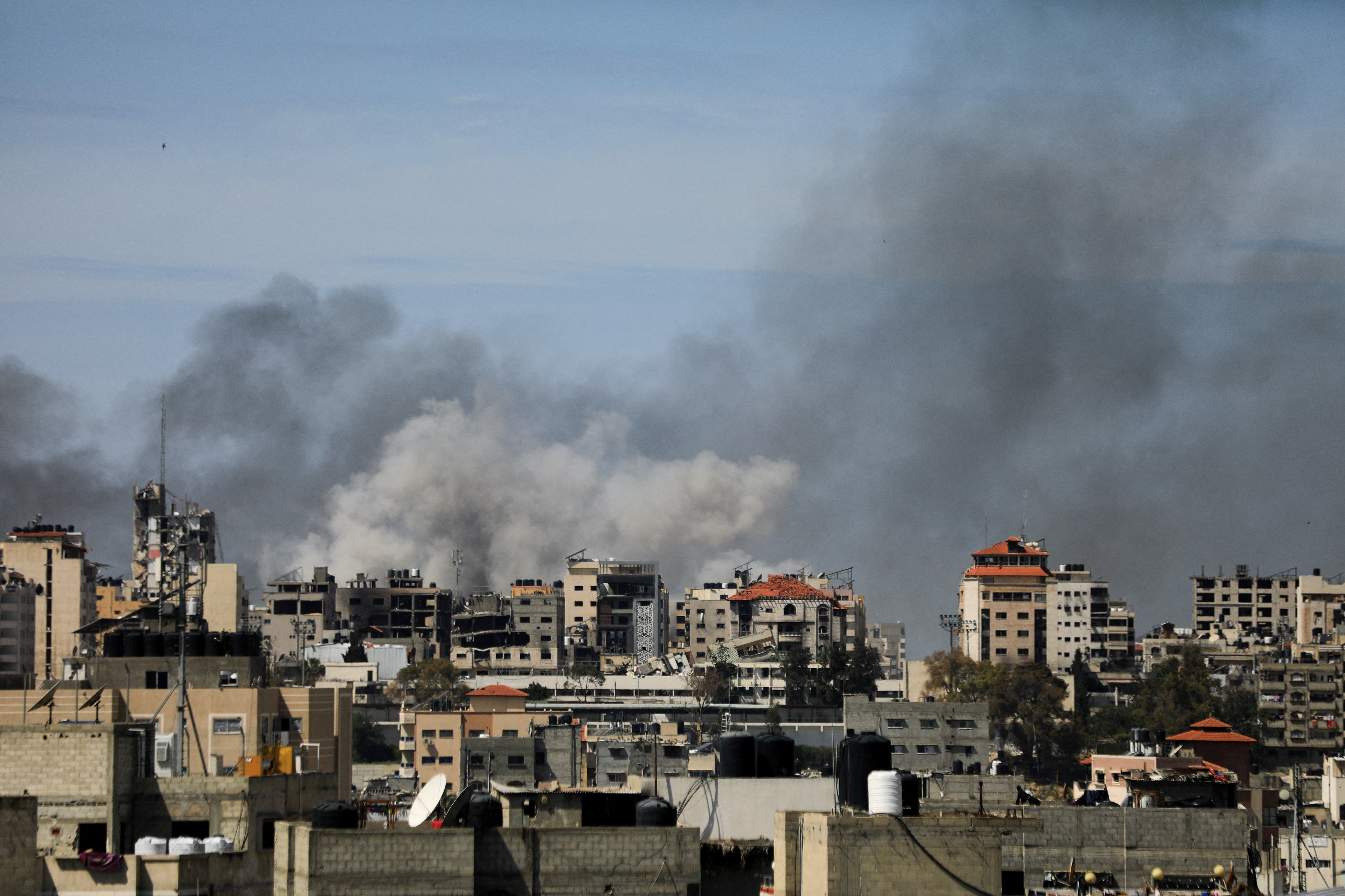 FILE PHOTO: Smoke rises during an Israeli raid at Al Shifa hospital and the area around it, amid the ongoing conflict between Israel and the Palestinian Islamist group Hamas, in Gaza City, March 21, 2024. 