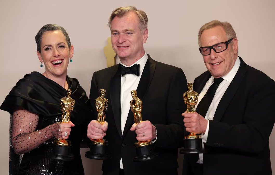 Christopher Nolan, Emma Thomas and Charles Roven pose with the Oscar for Best Picture for "Oppenheimer" in the Oscars photo room at the 96th Academy Awards in Hollywood, Los Angeles, California, March 10, 2024.