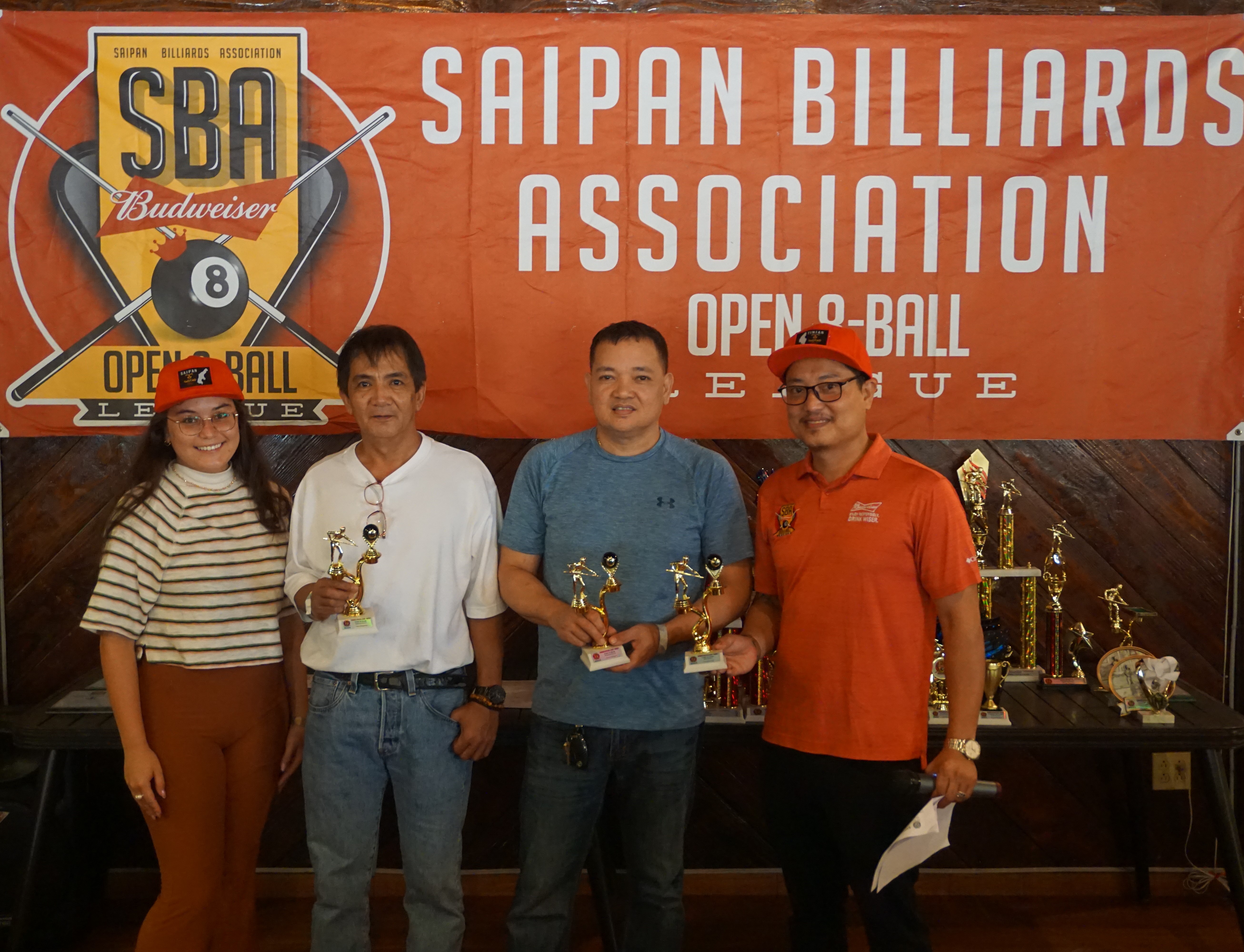 8-Ball on Break Thursday Division winners Roman Rodriguez and Cesar Sangalang hold their trophies as they pose for a photo with league secretary Ivan Sales and SBA representative Rox Trombeta during the awards banquet of the 2023 SBA Budweiser Open 8-Ball League at West Coast Restaurant on Sunday.