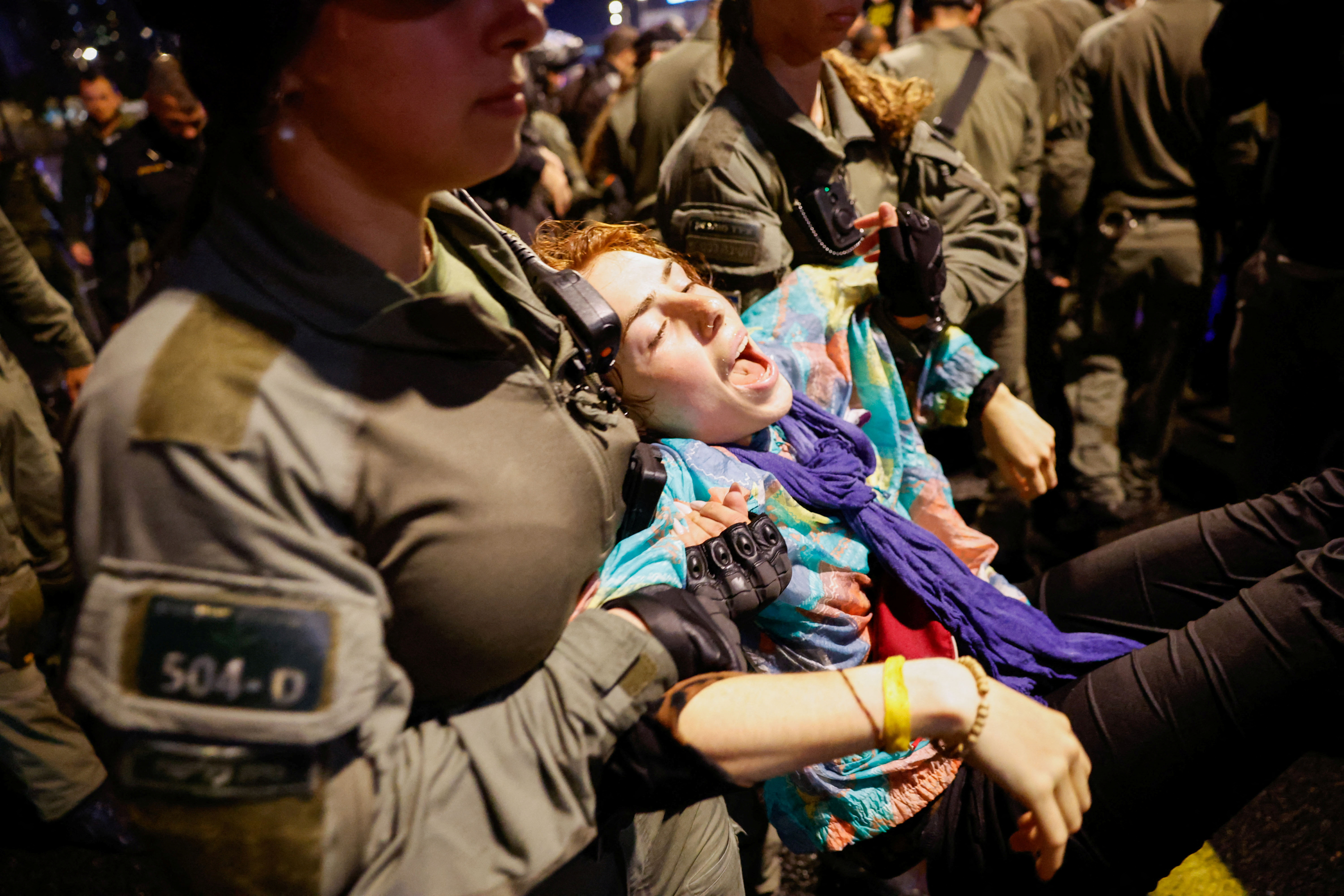 Police members carry a demonstrator during a protest calling for the release of hostages kidnapped in the deadly October 7 attack on Israel by the Palestinian Islamist group Hamas from Gaza, in Tel Aviv, Israel, March 9, 2024. 