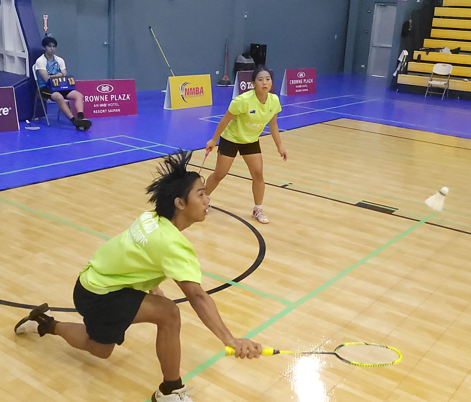 Marlon Bautista reaches out for the return as teammate Lina Tsukagoshi looks on during the championship match against Shaina Malonzo and Brandon Manacop in the U19 Mixed Doubles event of the Tan Holdings Badminton Open 2024 at the Ada gym on Sunday.