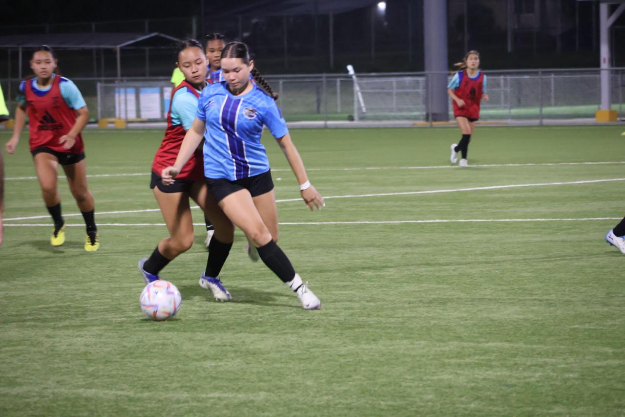MHS and SIS players fight for the possession during the girls high school division championship match of the NMIFA-PSS Interscholastic Soccer League SY23-24 at the NMI Soccer Training Center in Koblerville on Thursday.