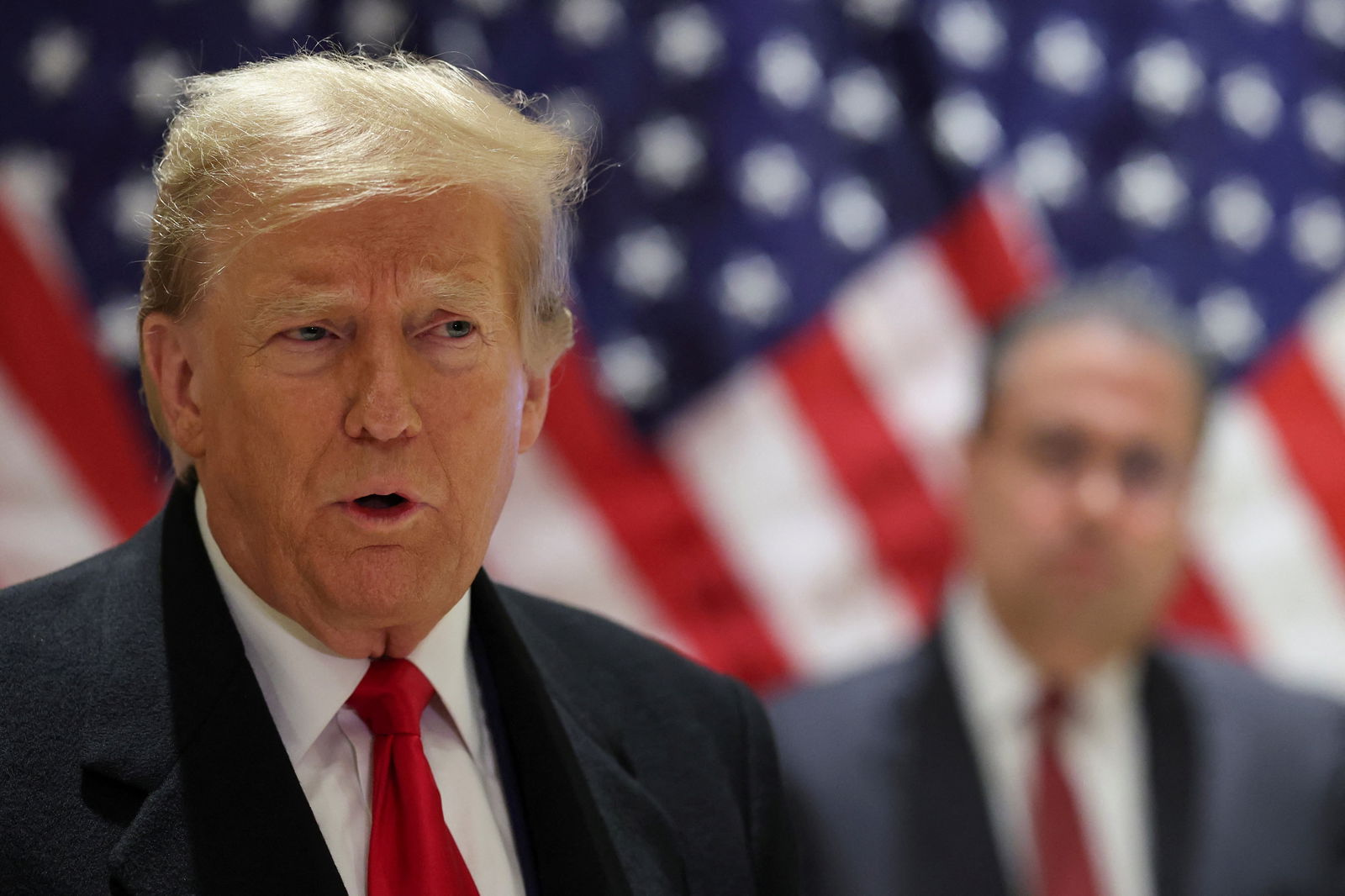 Republican presidential candidate and former U.S. President Donald Trump speaks during a press conference at one of his properties after attending a hearing in his criminal court case on charges stemming from hush money paid to a porn star in New York City, U.S., March 25, 2024. 