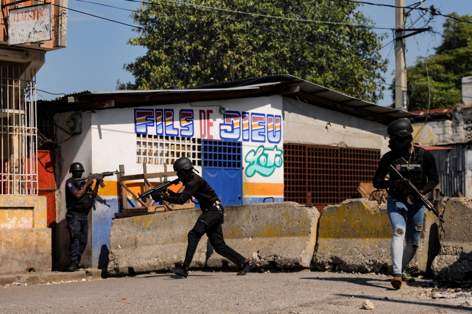 Police officers take part in an operation on the surroundings of the National Penitentiary following a fire, as a powerful gang leader in Haiti has issued a threatening message aimed at political leaders who would take part in a still-unformed transition council for the country, in Port-au-Prince, Haiti, March 14, 2024. 