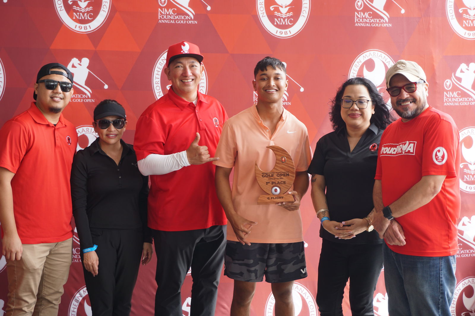 Antonio Norita holds the C Flight trophy as he poses for a photo with Northern Marianas College Foundation member Roman Tudela, Guam Hotel and Restaurant Association President Mary Rhodes, NMC Regent Dr. Jesse Tudela, NMC Regent Zenie Mafnas, and NMC President Galvin Deleon Guerrero, EdD, during the awards banquet of the NMC Foundation’s 19th Annual Golf Open at LaoLao Bay Golf & Resort on Sunday.
