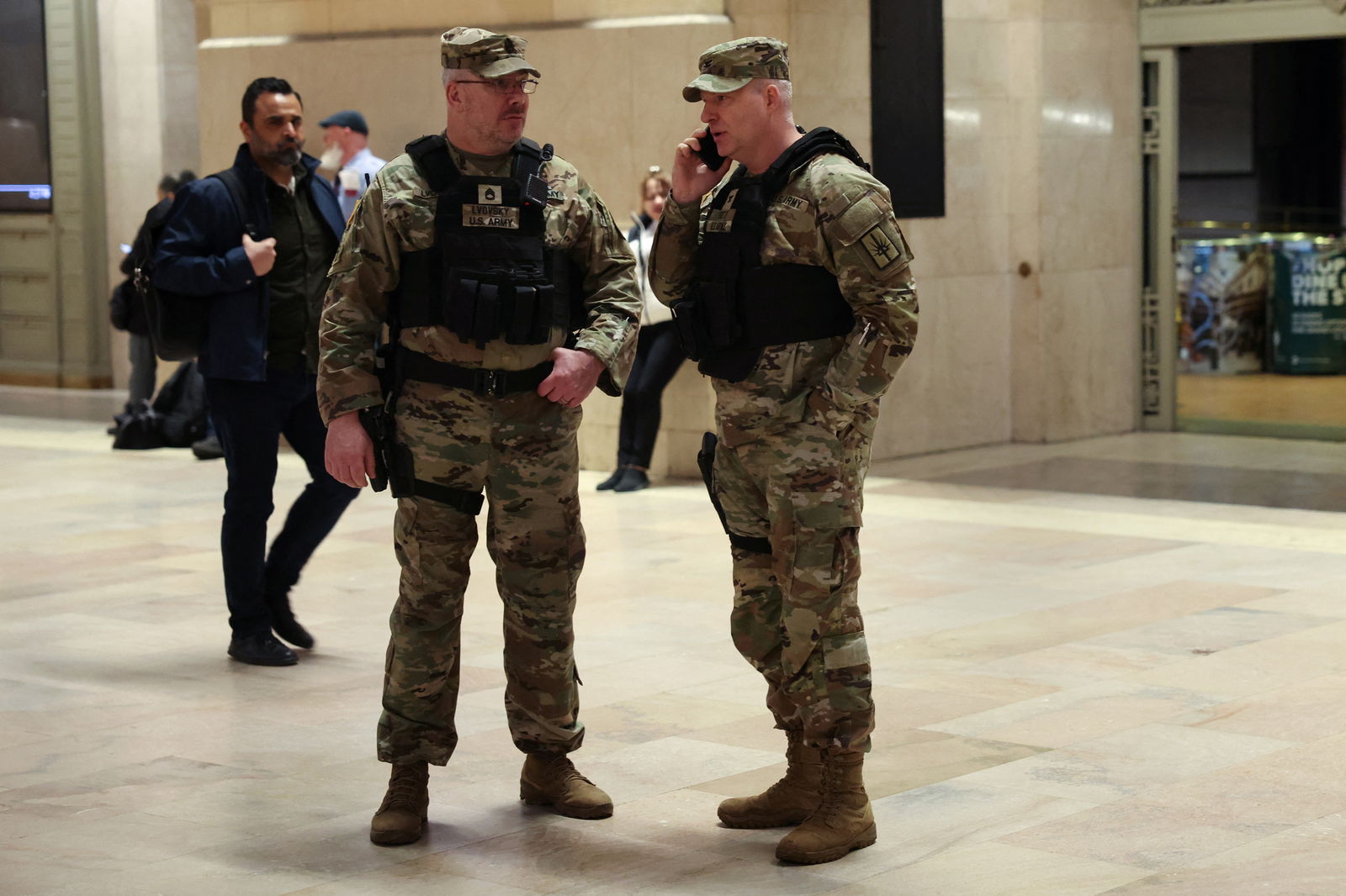 New York National Guard members stand guard inside Grand Central Station in New York City, U.S., March 6, 2024. REUTERS/Shannon Stapleton