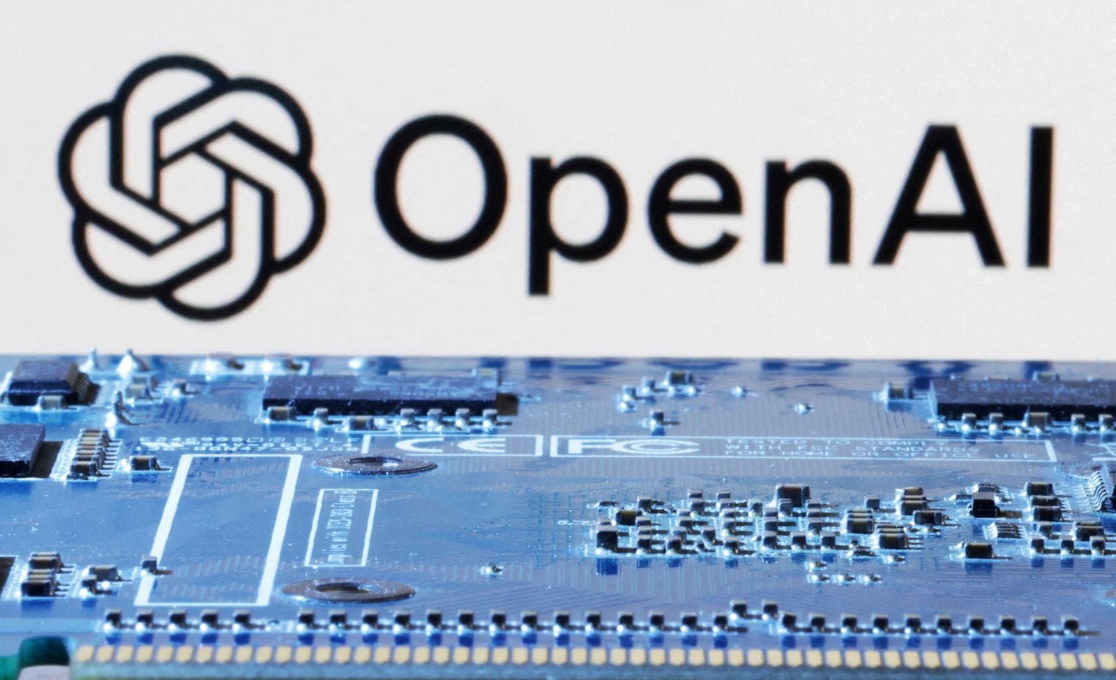 FILE PHOTO: OpenAI logo is seen near computer motherboard in this illustration taken January 8, 2024. 