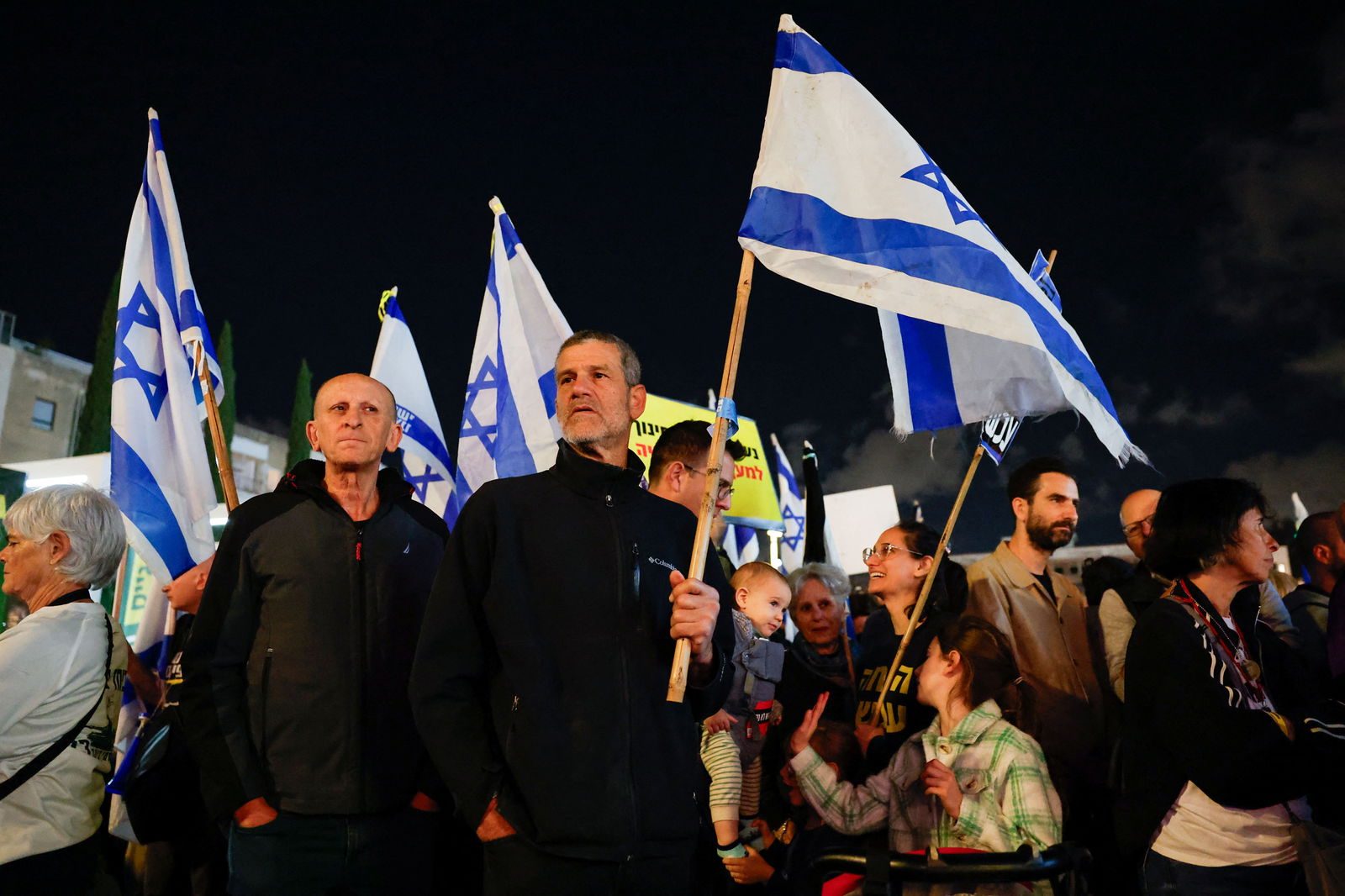 People attend a demonstration calling for the return of hostages held in Gaza since October 7 and against Israeli Prime Minister Benjamin Netanyahu's coalition government, demanding an end to the exemption of ultra-Orthodox Jewish men from compulsory military service, amid the ongoing conflict between Israel and Palestinian Islamist group Hamas, in Tel Aviv, Israel March 14, 2024. 