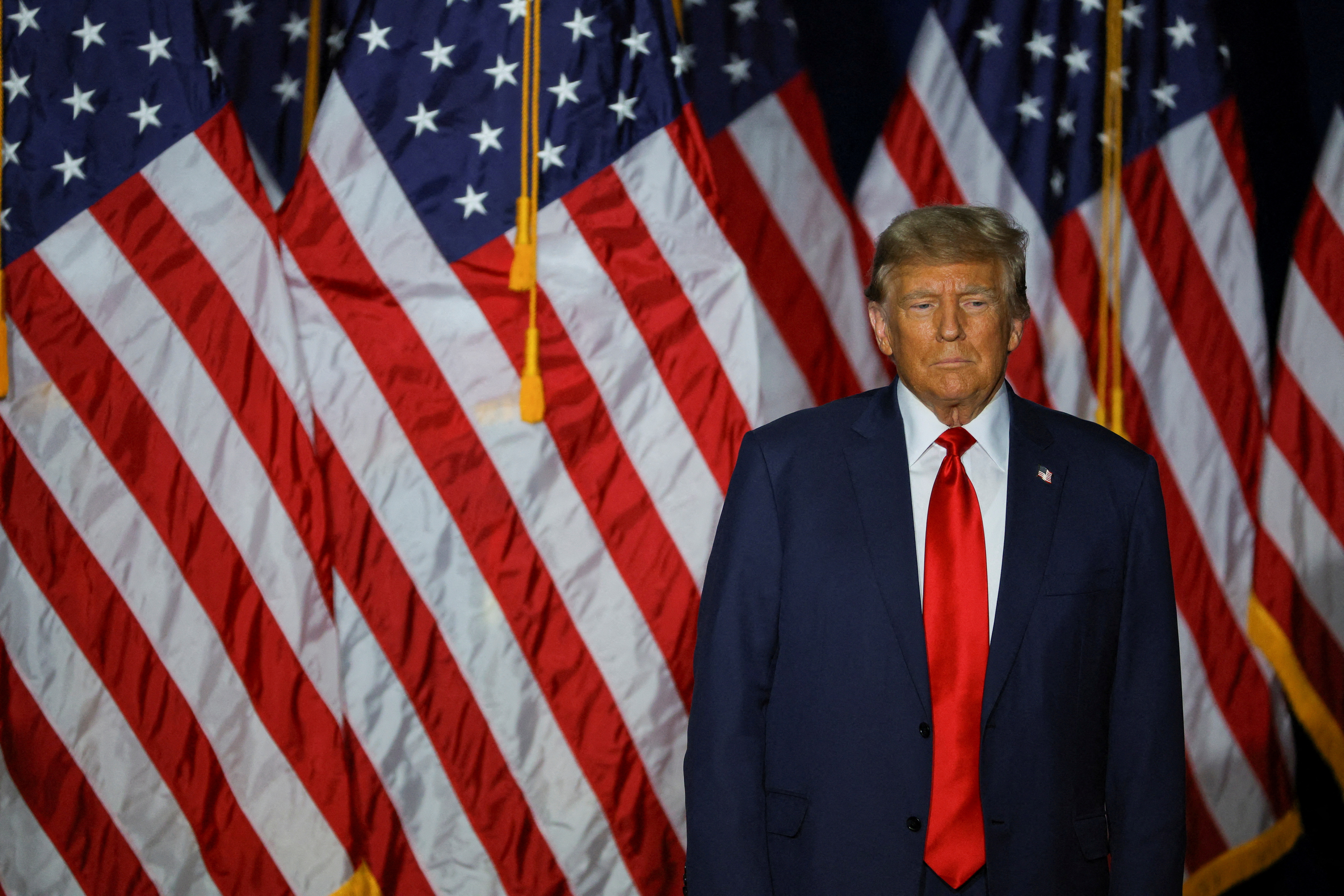 FILE PHOTO: Republican presidential candidate and former U.S. President Donald Trump reacts during his caucus night watch party in Des Moines, Iowa, U.S., January 15, 2024. 