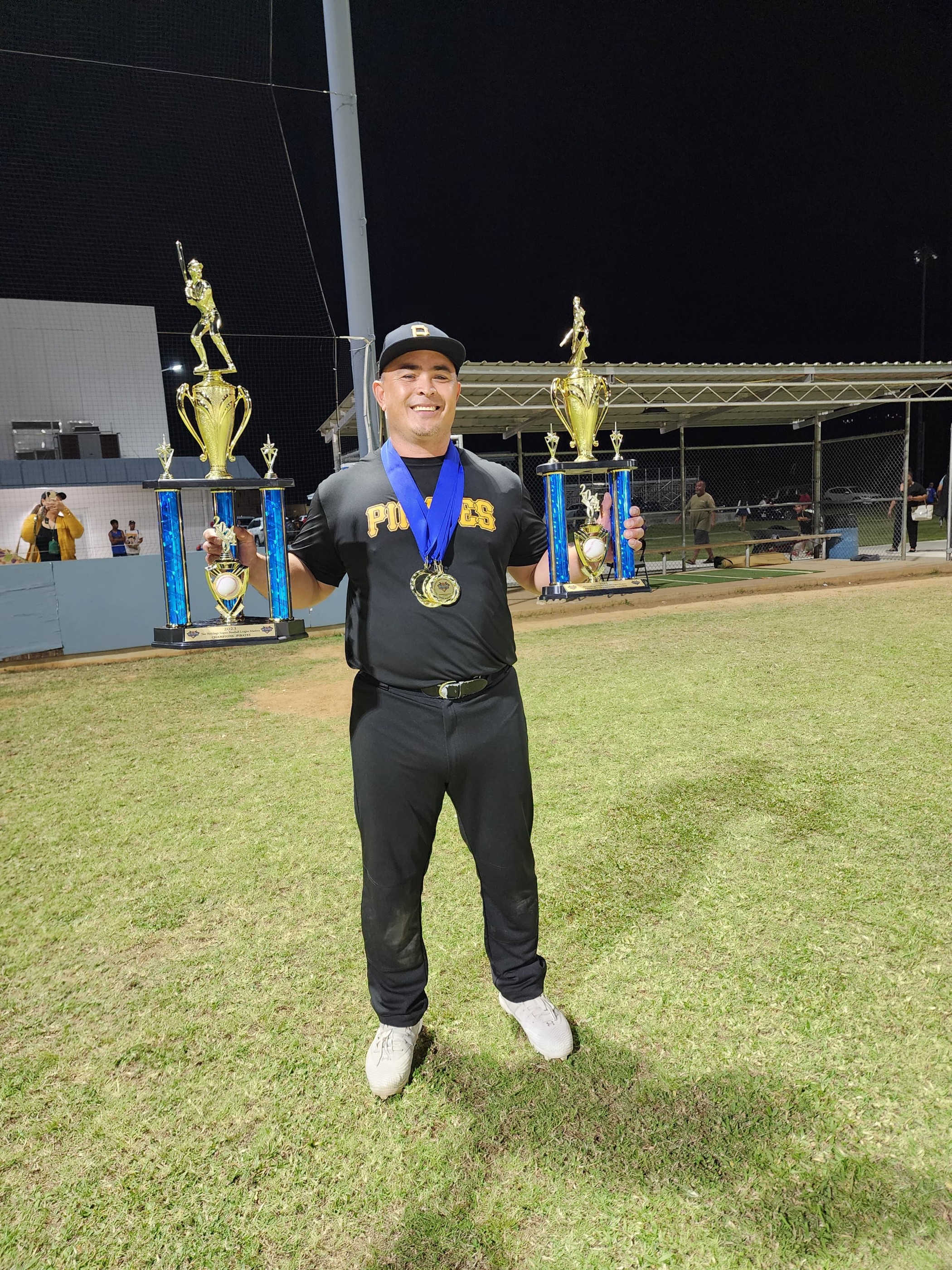 Audie Maratita poses with his awards and the championship and pennant trophies during the awards ceremony of the 2023 SBL Masters League at the Francisco "Tan Ko" Palacios Baseball Field on Wednesday.