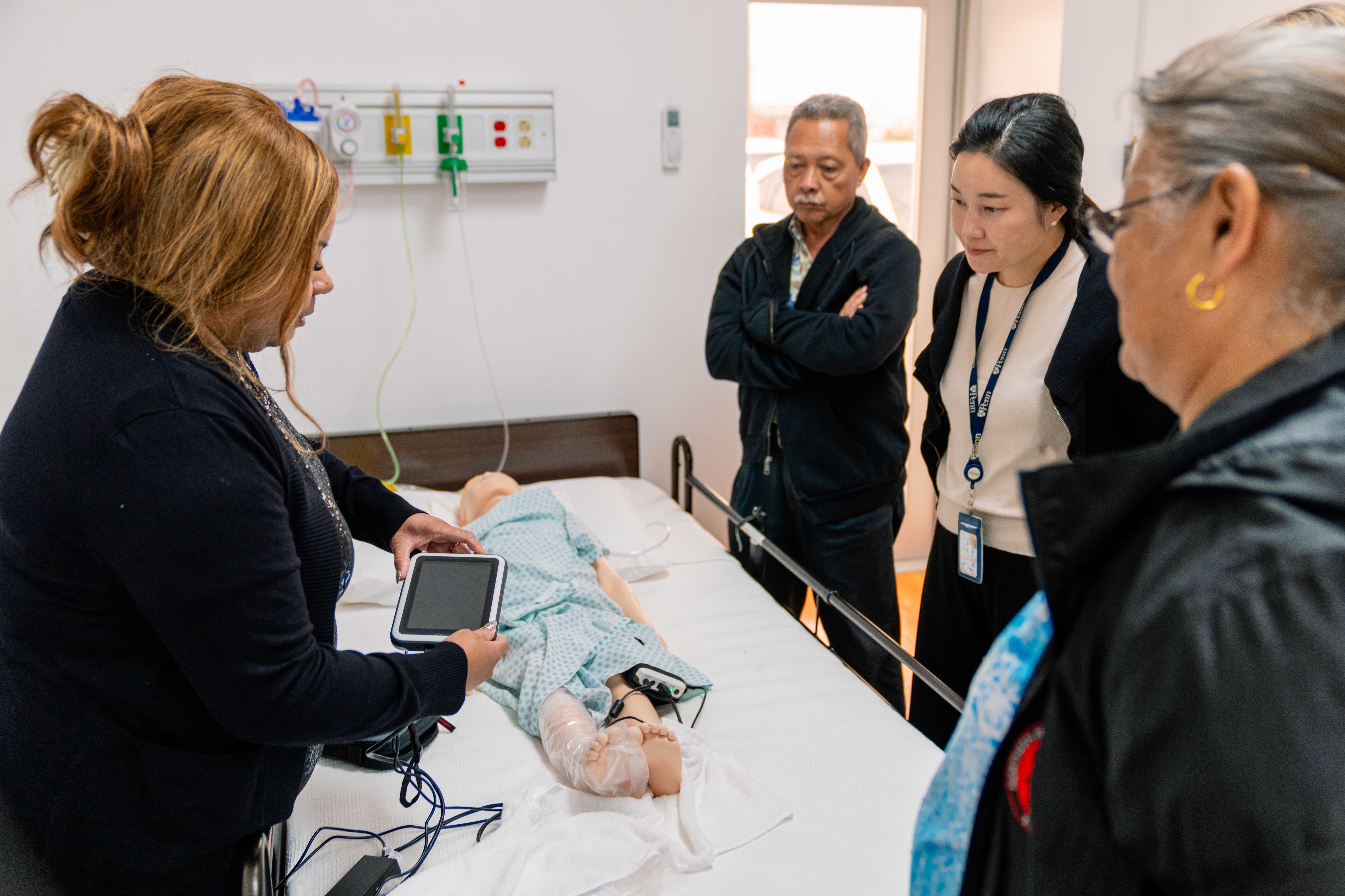 Associate Director of the Hawaii/Pacific Basin Area Health Education Center Erica Davis, left, conducts a training course for Northern Marianas College nursing instructors.
