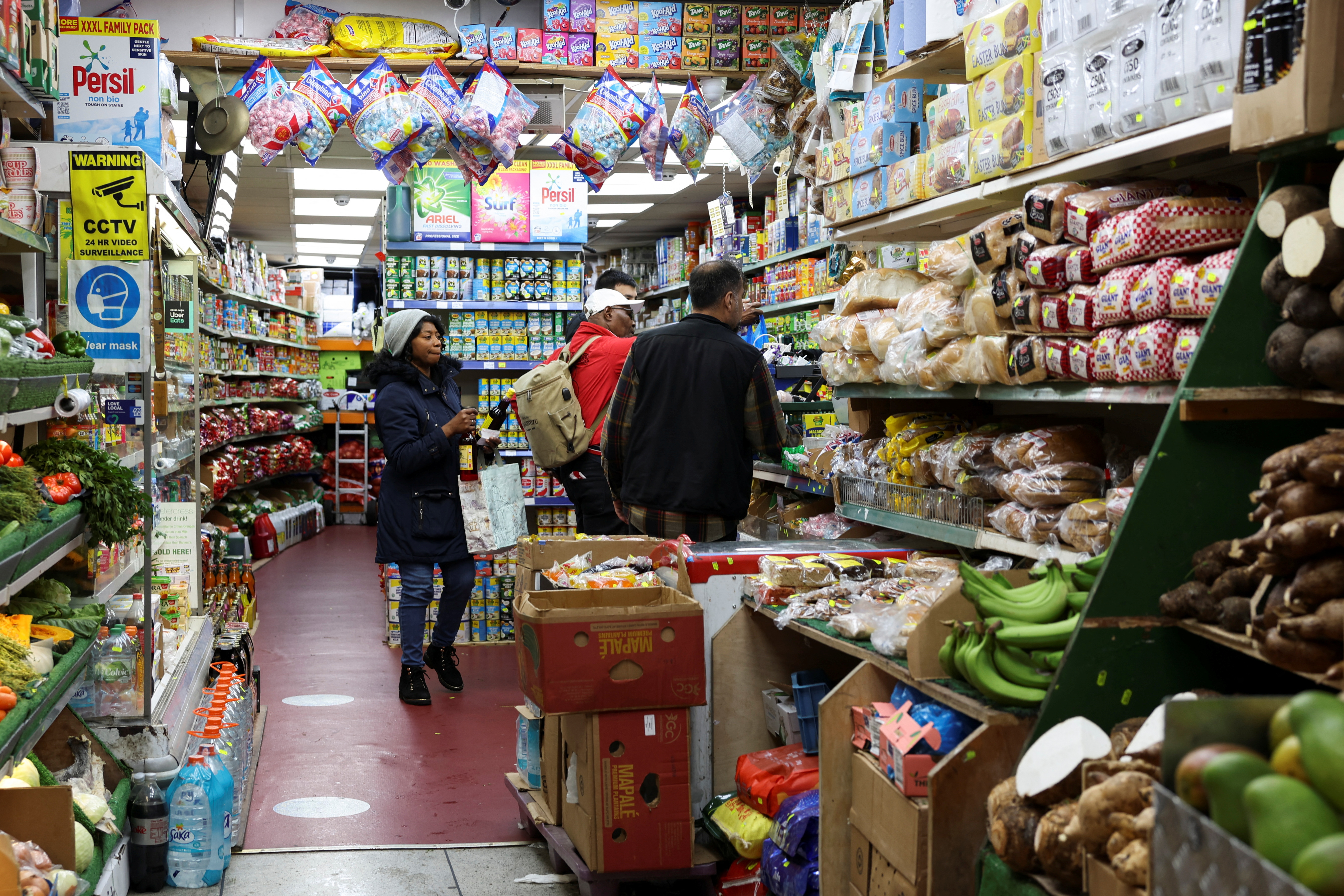 People shop at a grocery market, in London, Britain May 6, 2023. 
