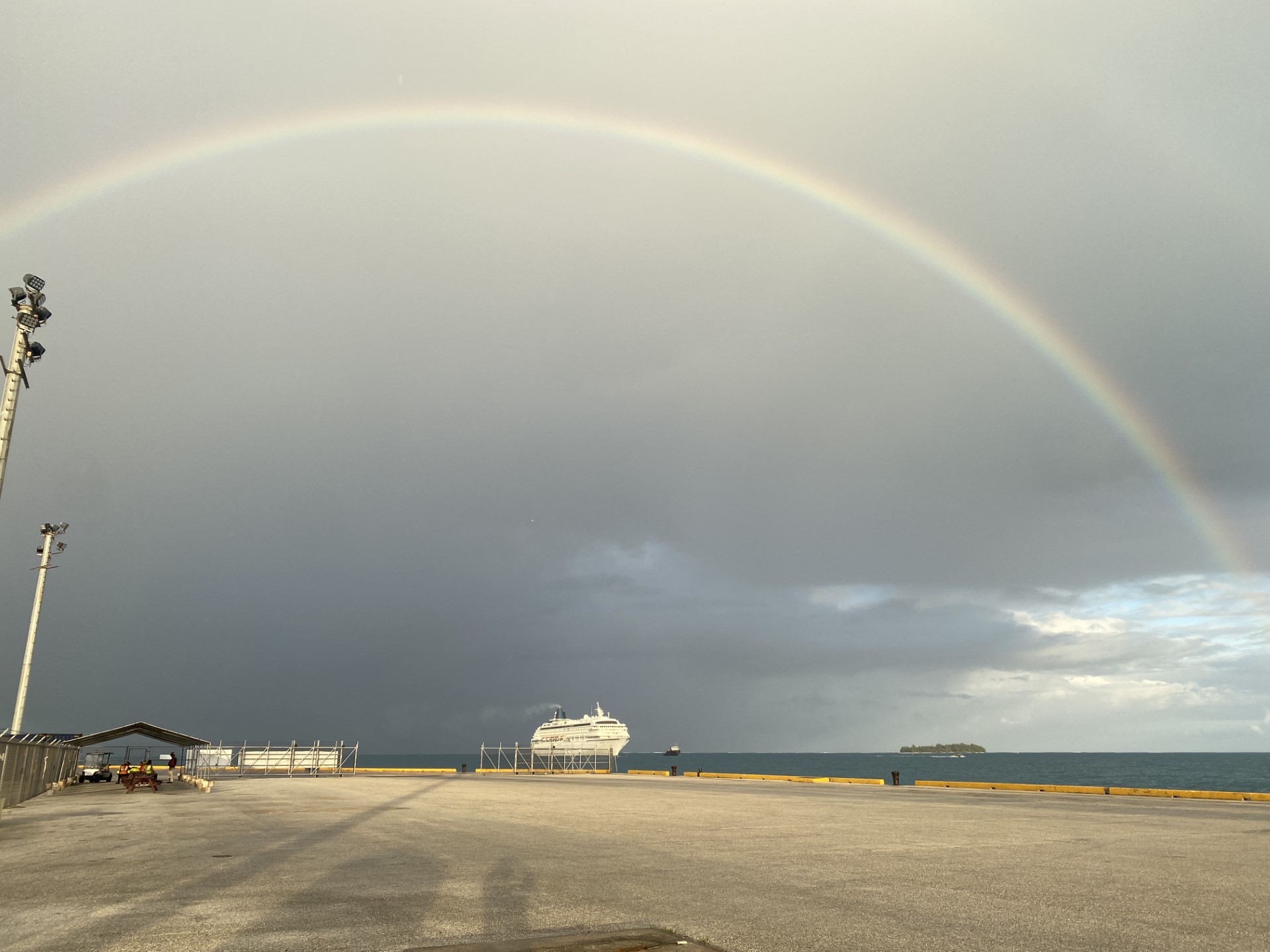 With a rainbow overhead, the Asuka II makes its way to the Port of Saipan on Monday, March 4. Hundreds of passengers and crew are onboard.