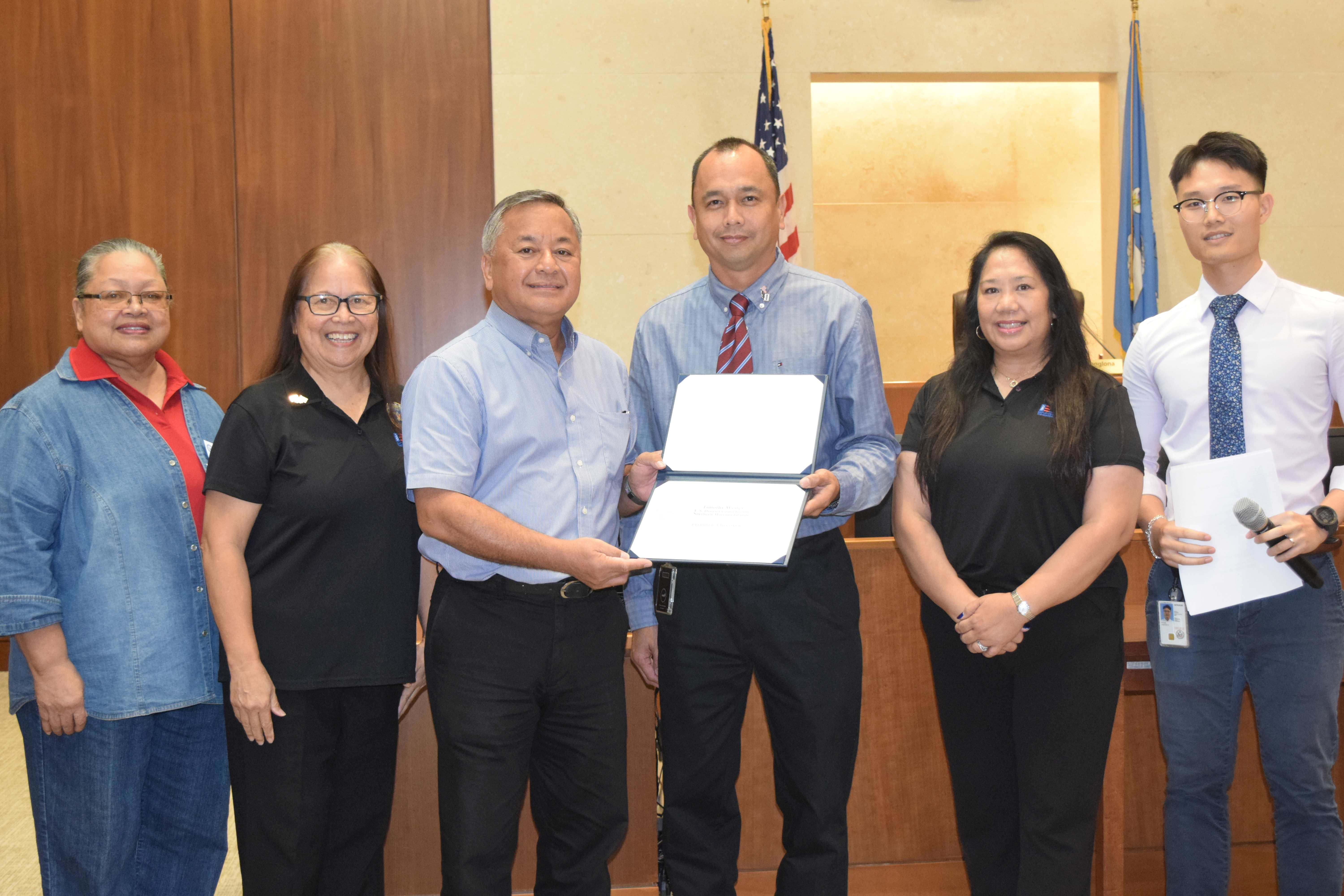 District Court for NMI Operations Supervisor Timothy V. Wesley, third right, and U.S. Air Force Reserve Senior Airman Justin Xu Poon, right, with Employer Support for the Guard and Reserve Guam-CNMI Area Chair Rita A. Sablan, Ed.D., second left, Civilian Aide to the U.S. Secretary of Army Mike Sablan, third left, ESGR Ombudsman Joann Aquino, second right, and Employer Outreach Coordinator Rose Igitol, left.
