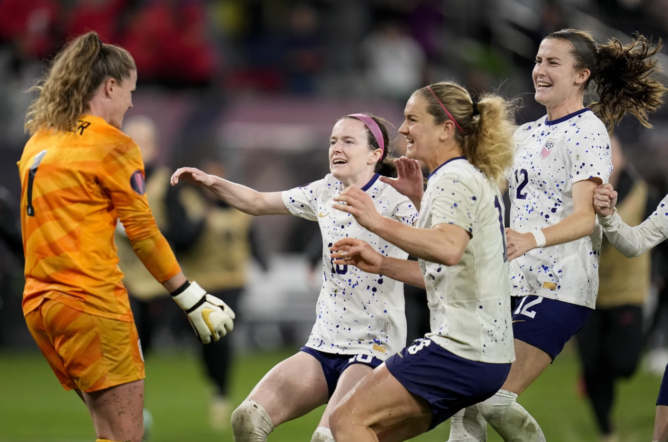United States goalkeeper Alyssa Naeher, left, celebrates with teammates at the end of the penalty shootout in a CONCACAF Gold Cup women’s soccer tournament semifinal match against Canada, March 6, 2024, in San Diego.