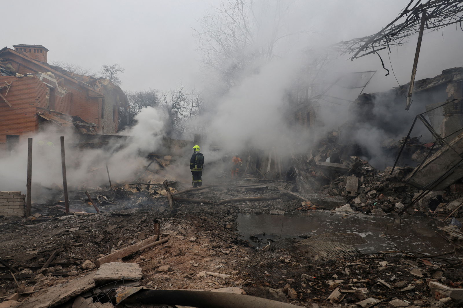 A rescuer stands in a residential area hit by a Russian missile strike, amid Russia's attack on Ukraine, in Odesa, Ukraine March 15, 2024. 