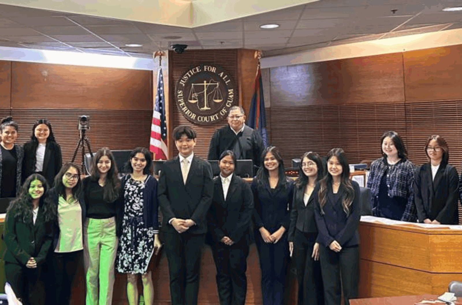 Participants of the second Mock Trial Friendship Tournament featuring Southern High School, Academy of Our Lady of Guam and Marianas High School gather for a photo in a Superior Court of Guam courtroom. 