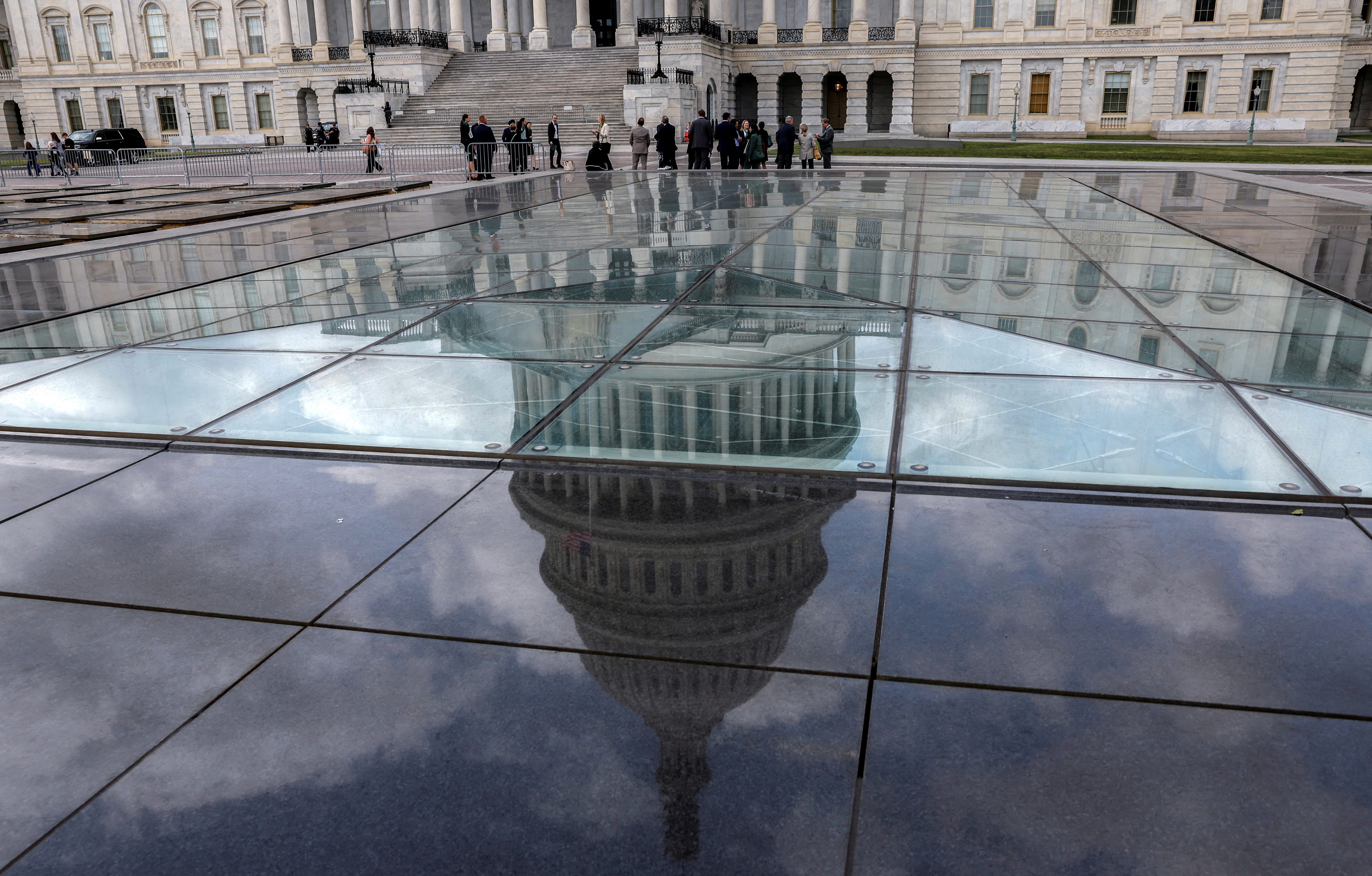 FILE PHOTO: The U.S. Capitol dome is seen in a reflection outside the United States Capitol building in Washington, U.S., September 22, 2023. 