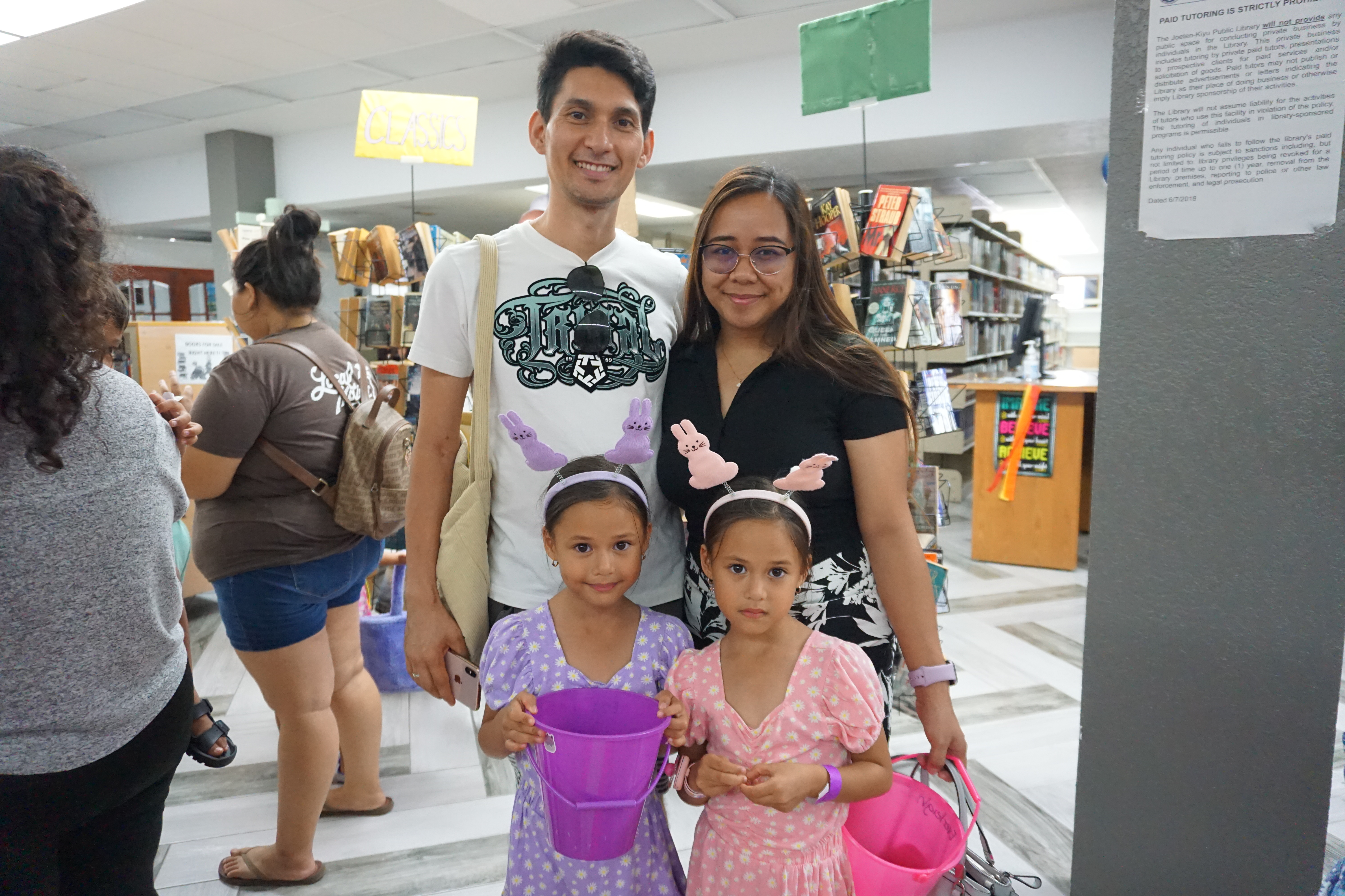 Front row, Erzaleah and Everleigh Such, back row, their parents John and Doreen Such. The Such family participated in an Easter egg hunt at Joeten-Kiyu Public Library on Thursday, March 28.​